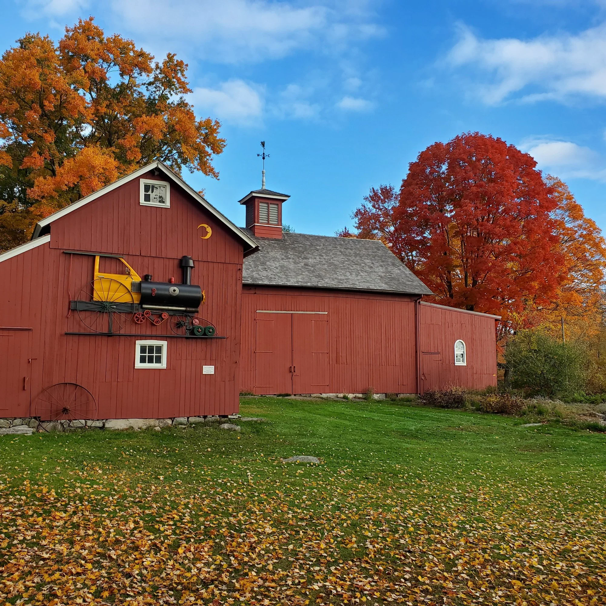 The Coley Barn with autumn maples, fall 2022