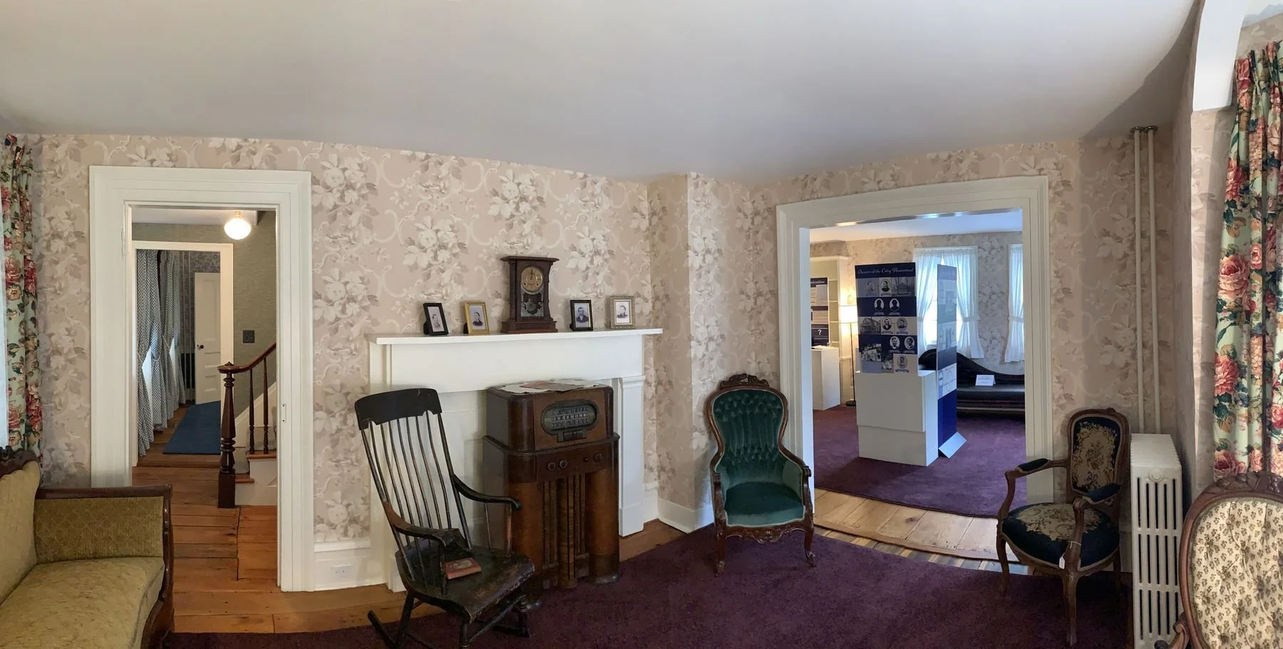 The parlor, with the family's radio beside the fireplace.
