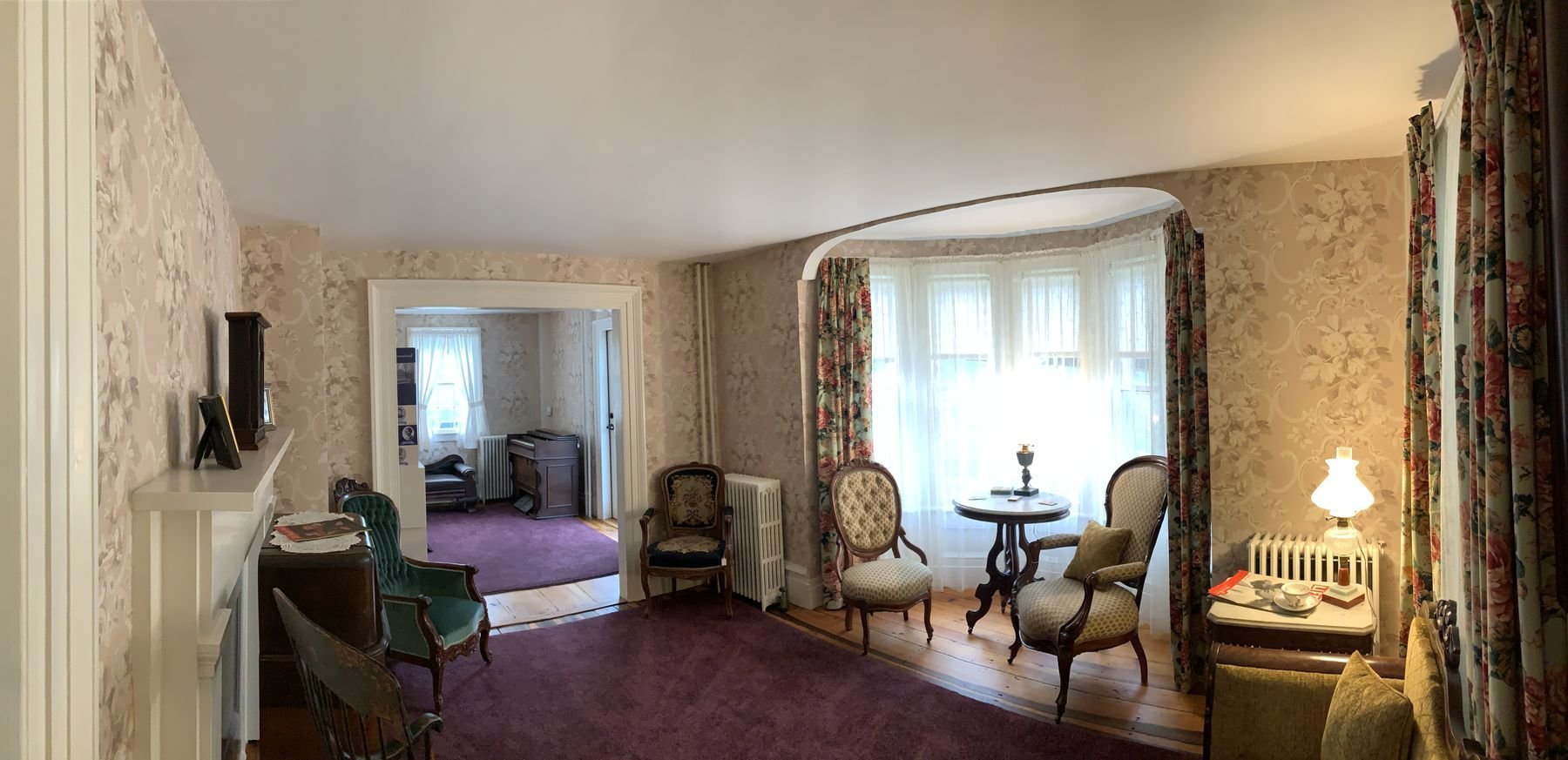 The front parlor, with its bay window and 1940s wallpaper.