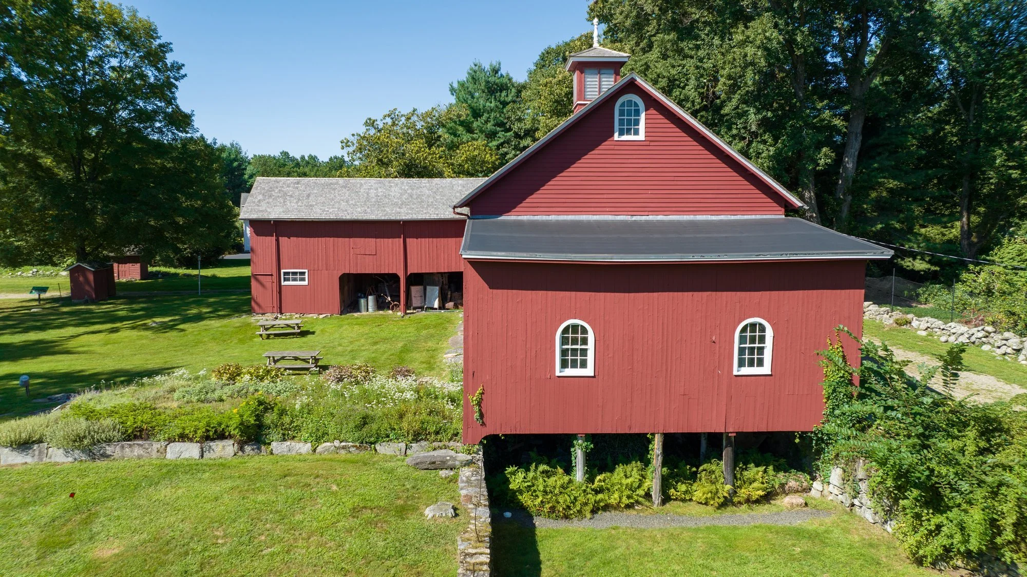 The Coley Barn and its garden beds from above, summer 2023
