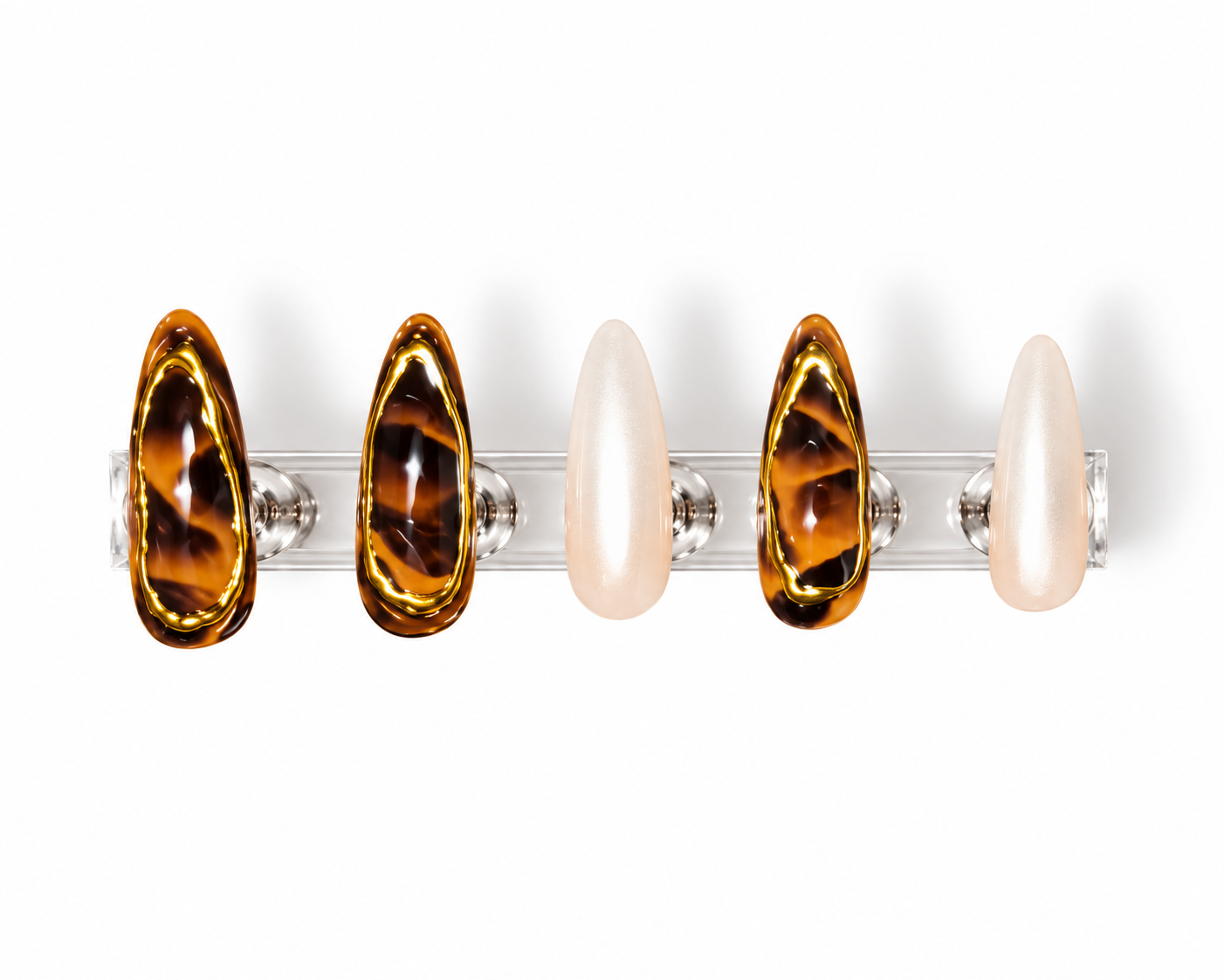 A set of custom nails, on a clear display, alternating between tortoiseshell, and white pearl chrome.