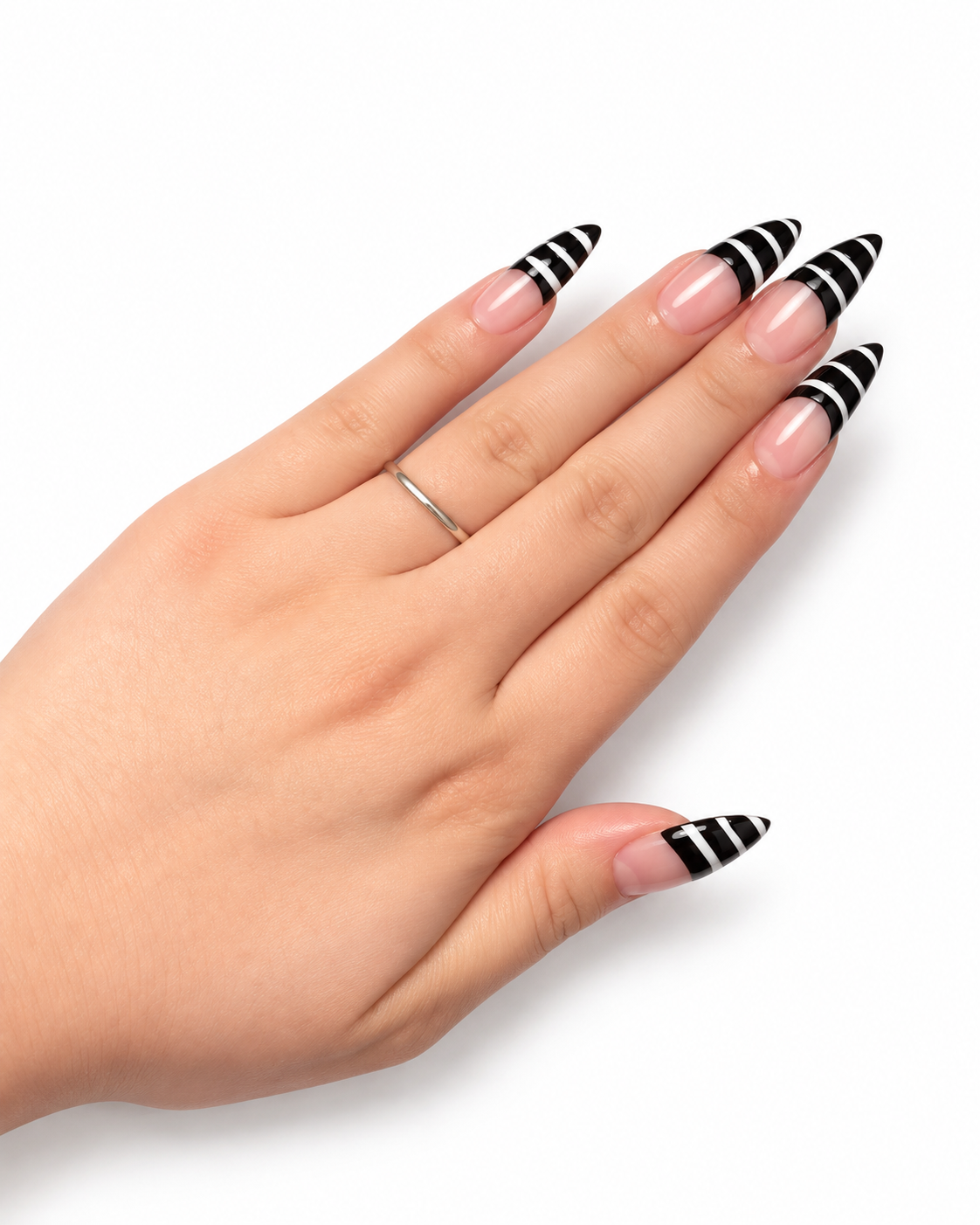 Close-up of a hand with black and white striped long nail designs.