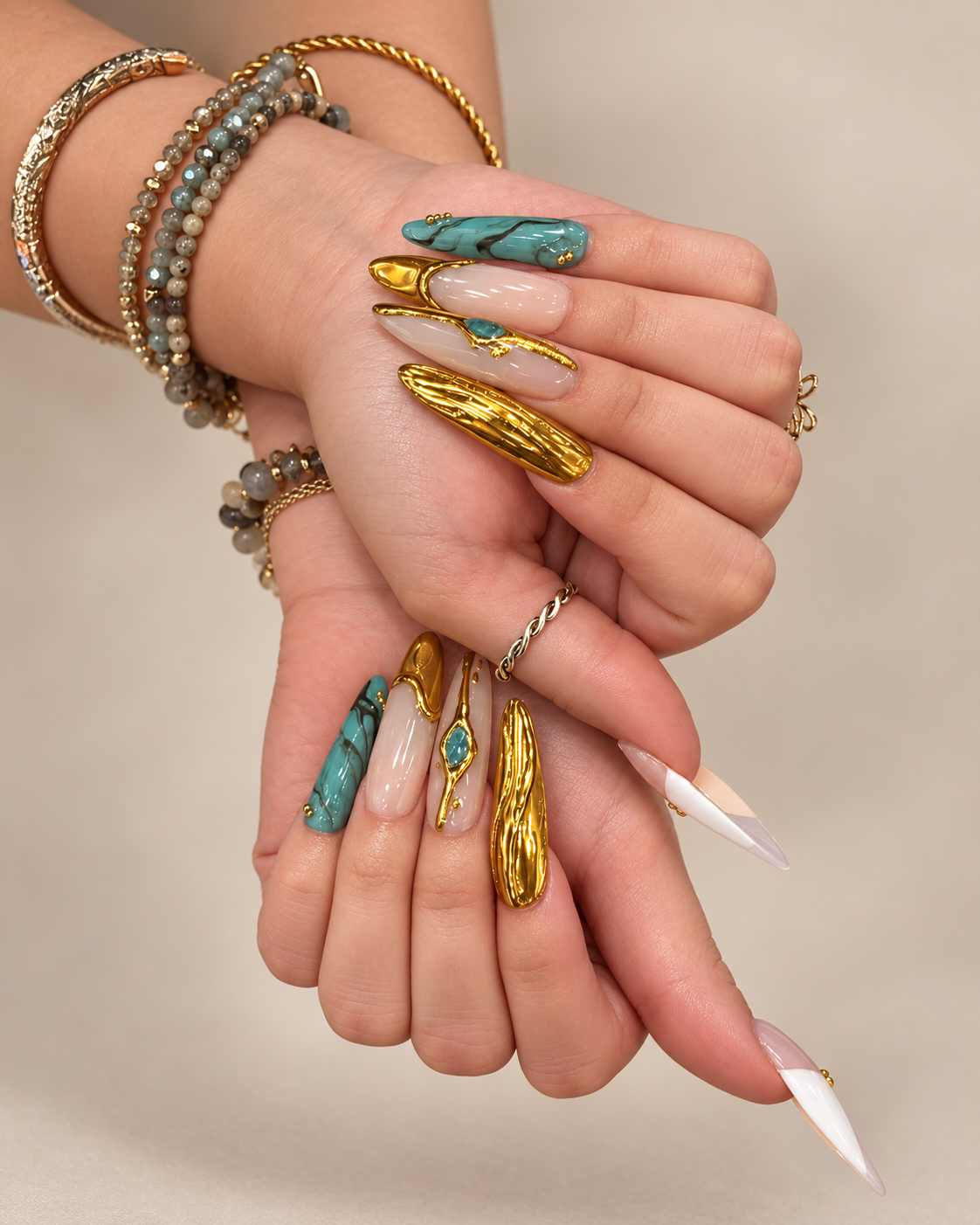Close-up of two hands with elaborate nail art.