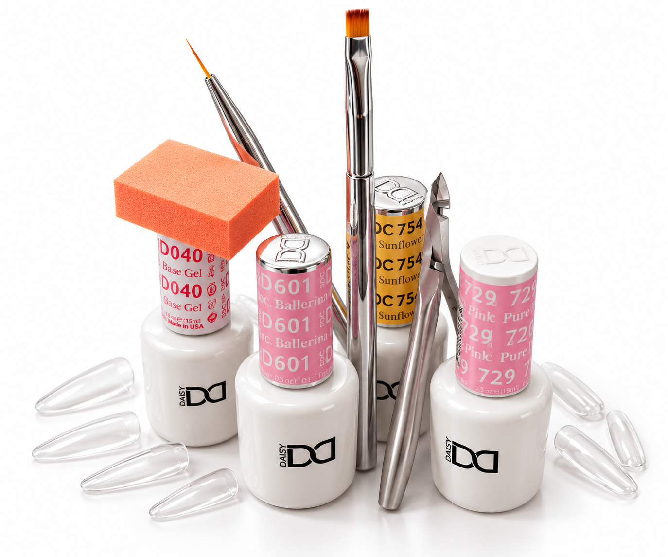 Nail polish bottles, brushes, and nail art tools arranged on a white surface, with clear nail tips around them.