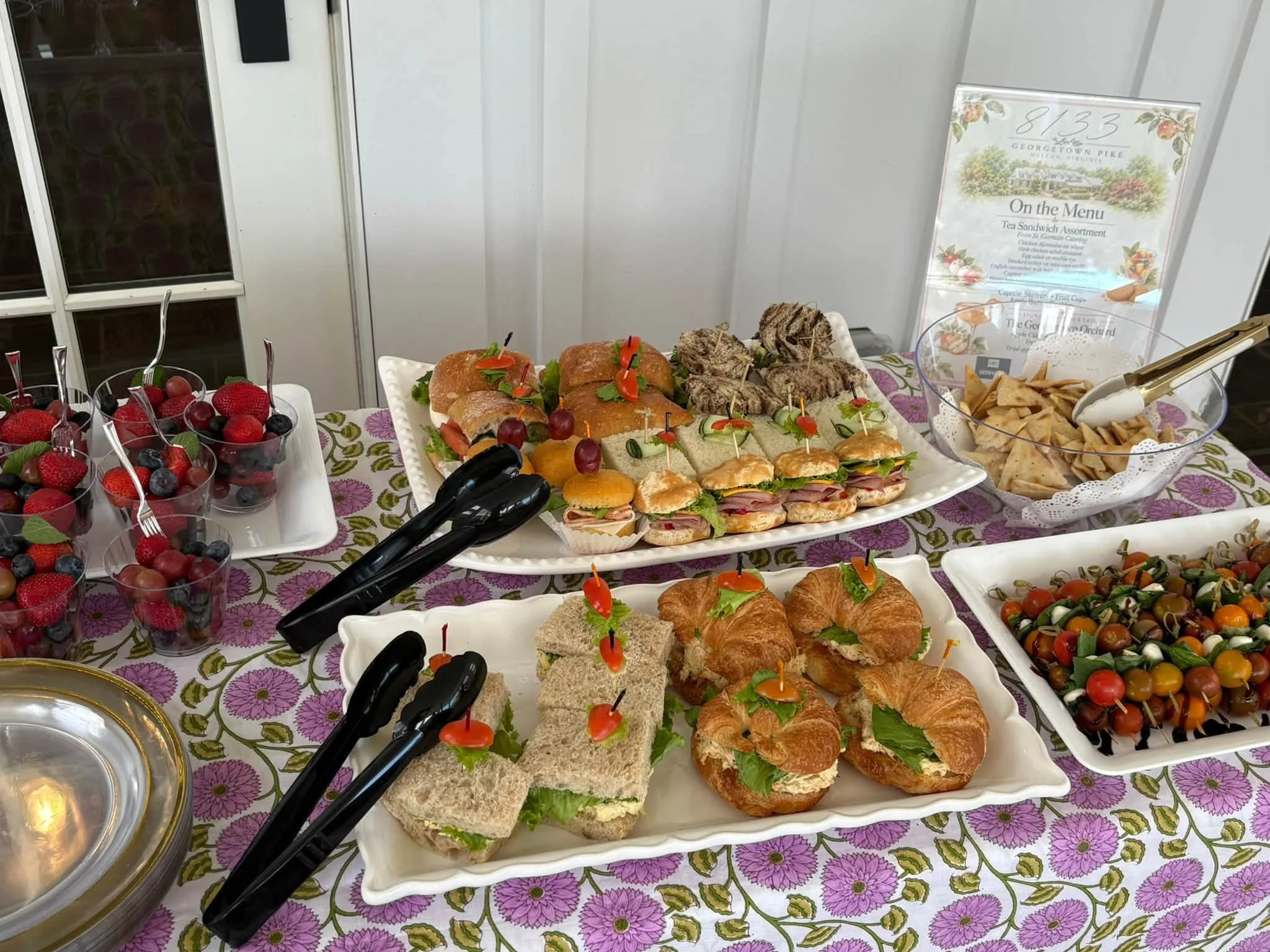 Tea sandwiches, fresh fruit, and little bites made for gathering.