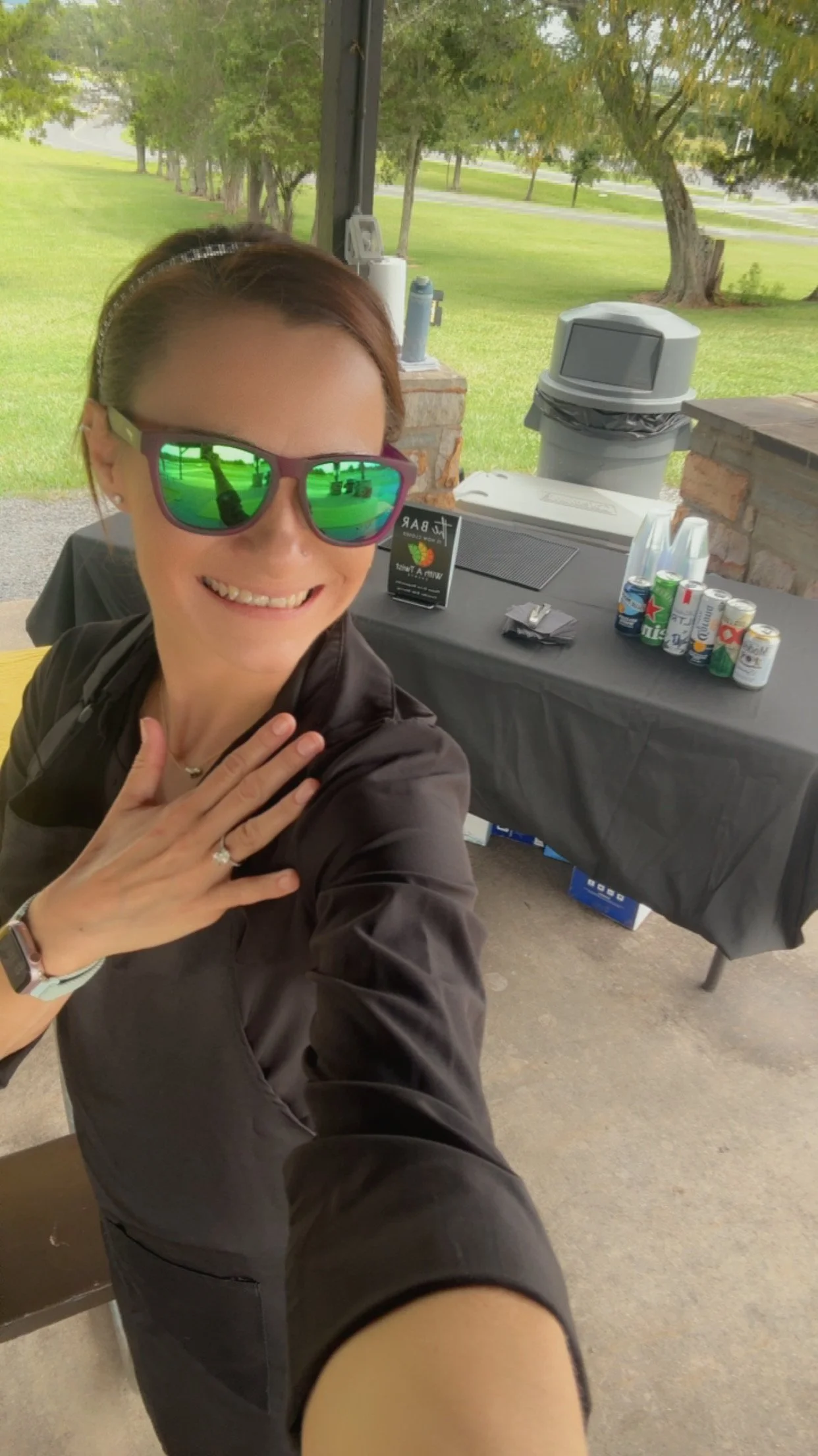 Megan ready to welcome guests at an outdoor bar.