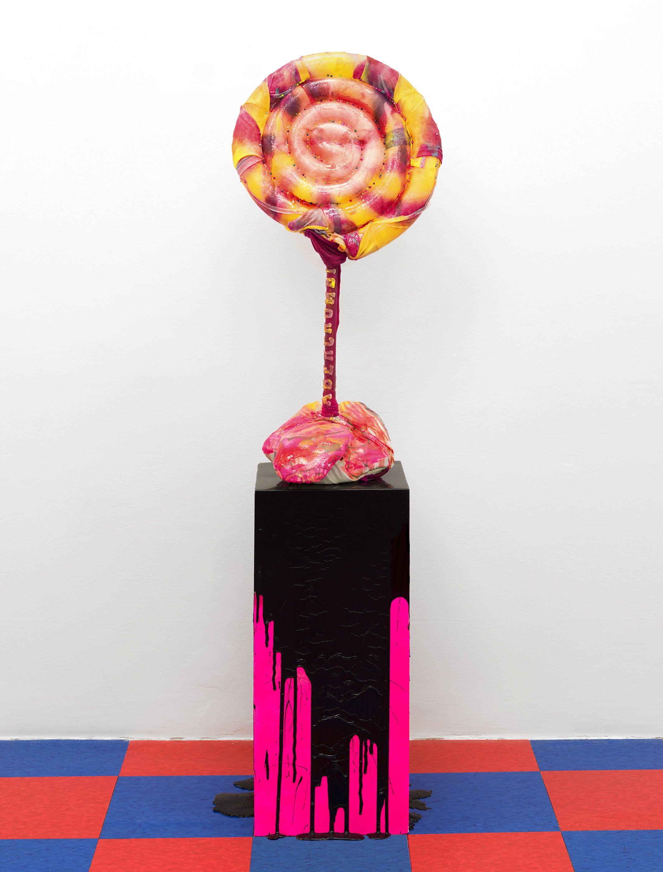 Cherry (Licker Treat), 2026. Custom all over print lollipop girl polyester t-shirt size XS, taxidermy pins, plunger, foam, watercolor, acrylic, Abercrombie & Fitch t-shirts, ероху. 12 in. x 35 in. on pink liquid rubber pedestal.

