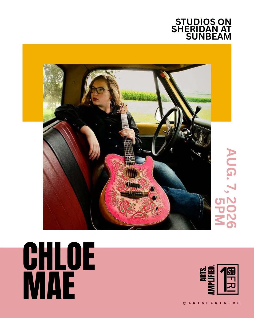 A woman with glasses and wavy hair sitting in a vintage bus, holding a pink decorated acoustic guitar, with window views of greenery outside, promoting an art event on August 7, 2026, at 5 PM, featuring artist Chloe Mae.