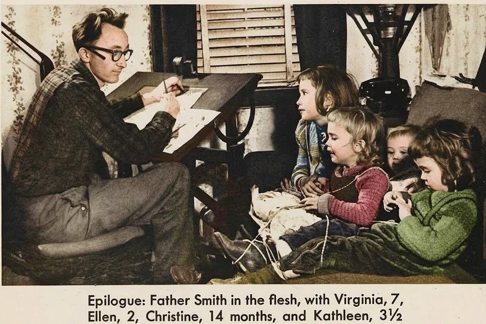 A man with glasses sitting at a desk drawing or writing, with four children sitting on a couch and watching him.