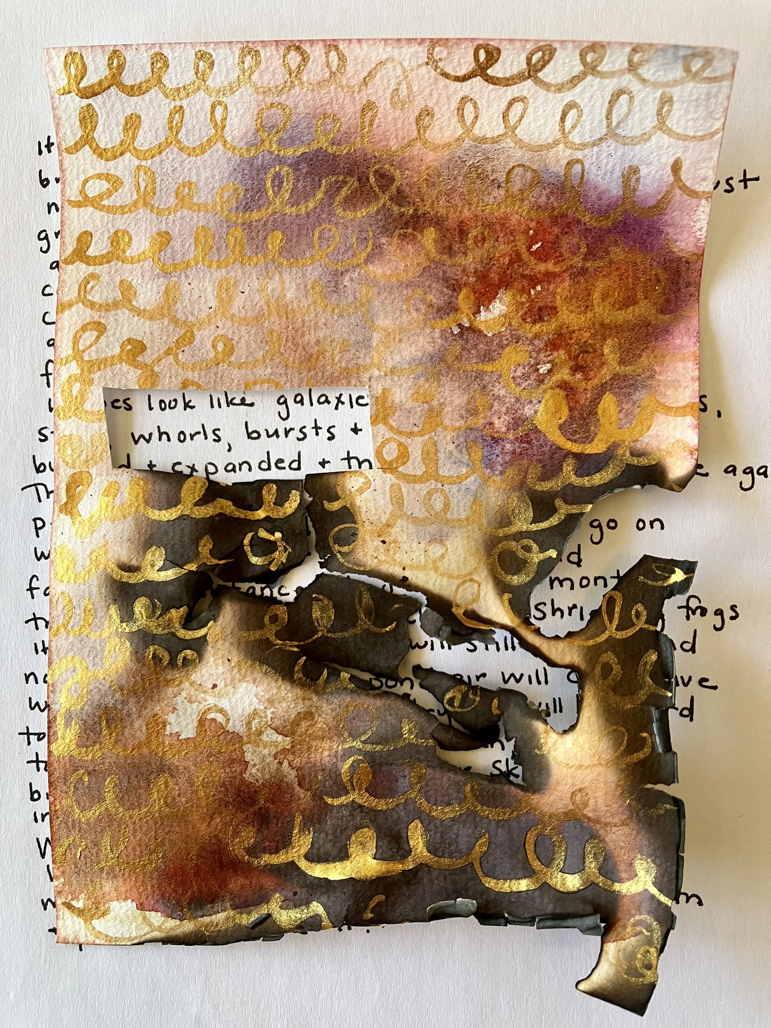 A piece of paper with a watercolor background in shades of red, purple, and orange, overlaid with gold calligraphic swirl designs, and a small handwritten note attached to the bottom left corner.