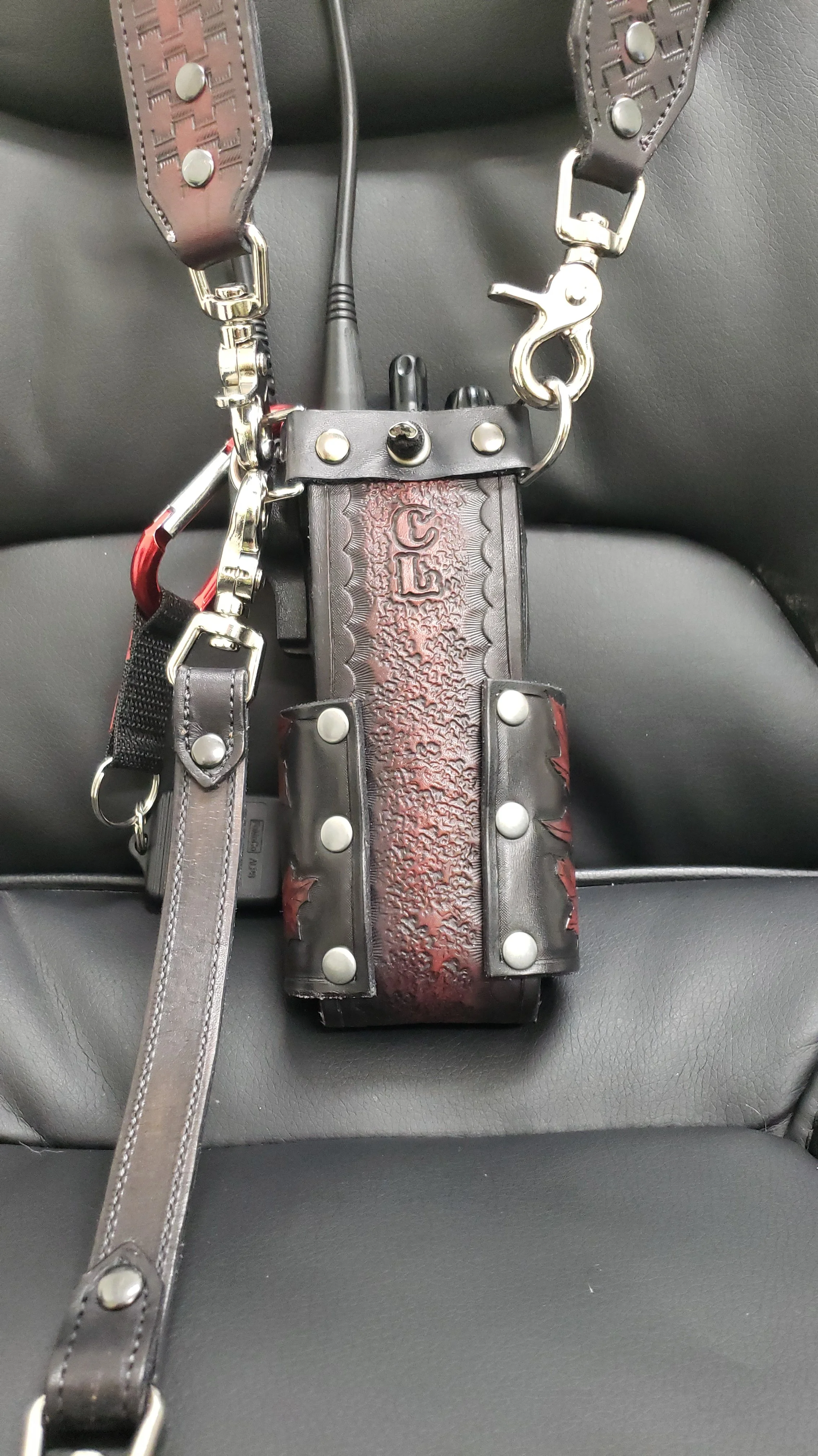 Awl Star Leather handcrafted radio harness with leather radio basket and metal hardware.