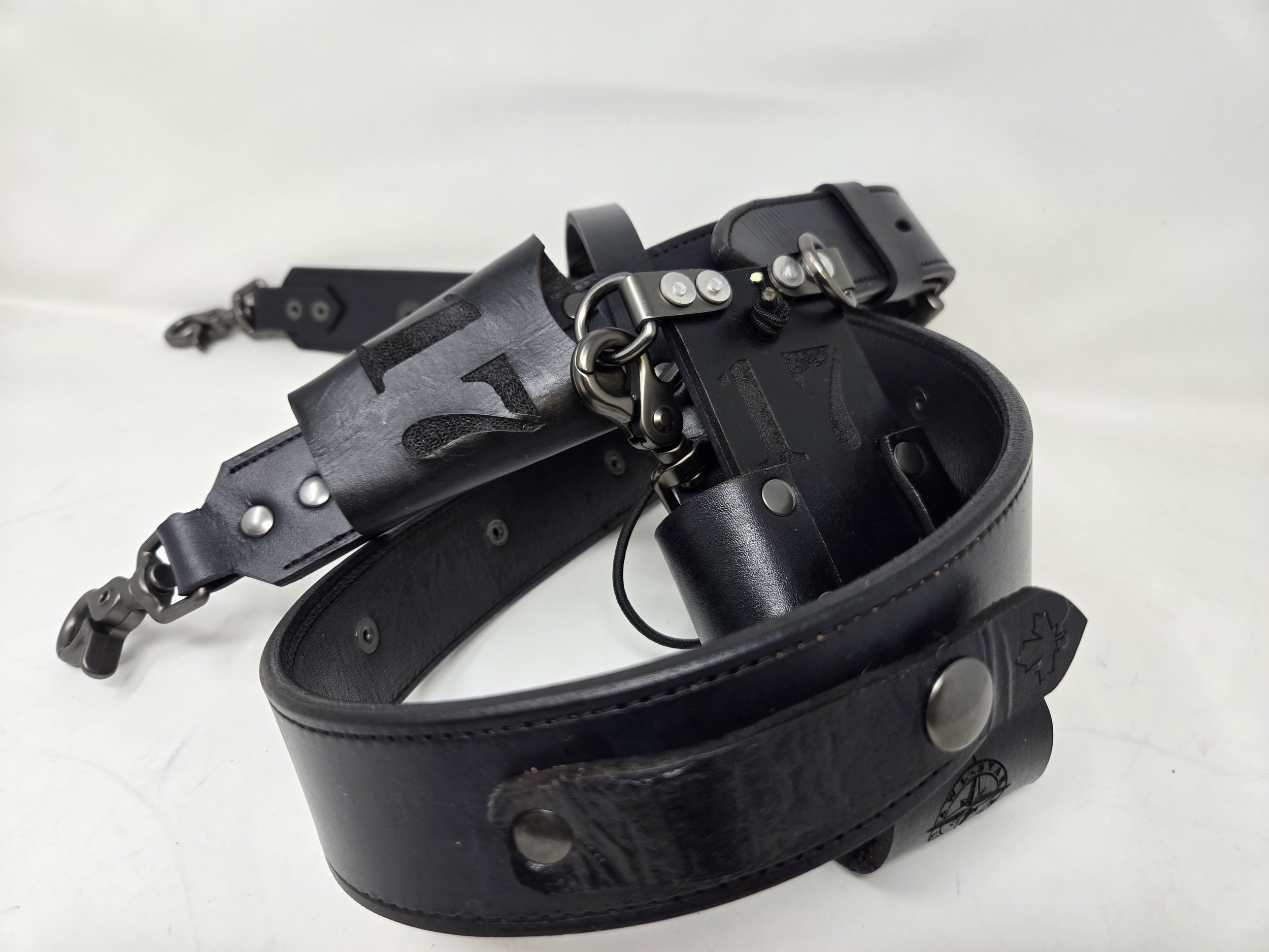 Awl Star Leather black leather radio harness with radio basket, adjustable shoulder strap and metal hardware.