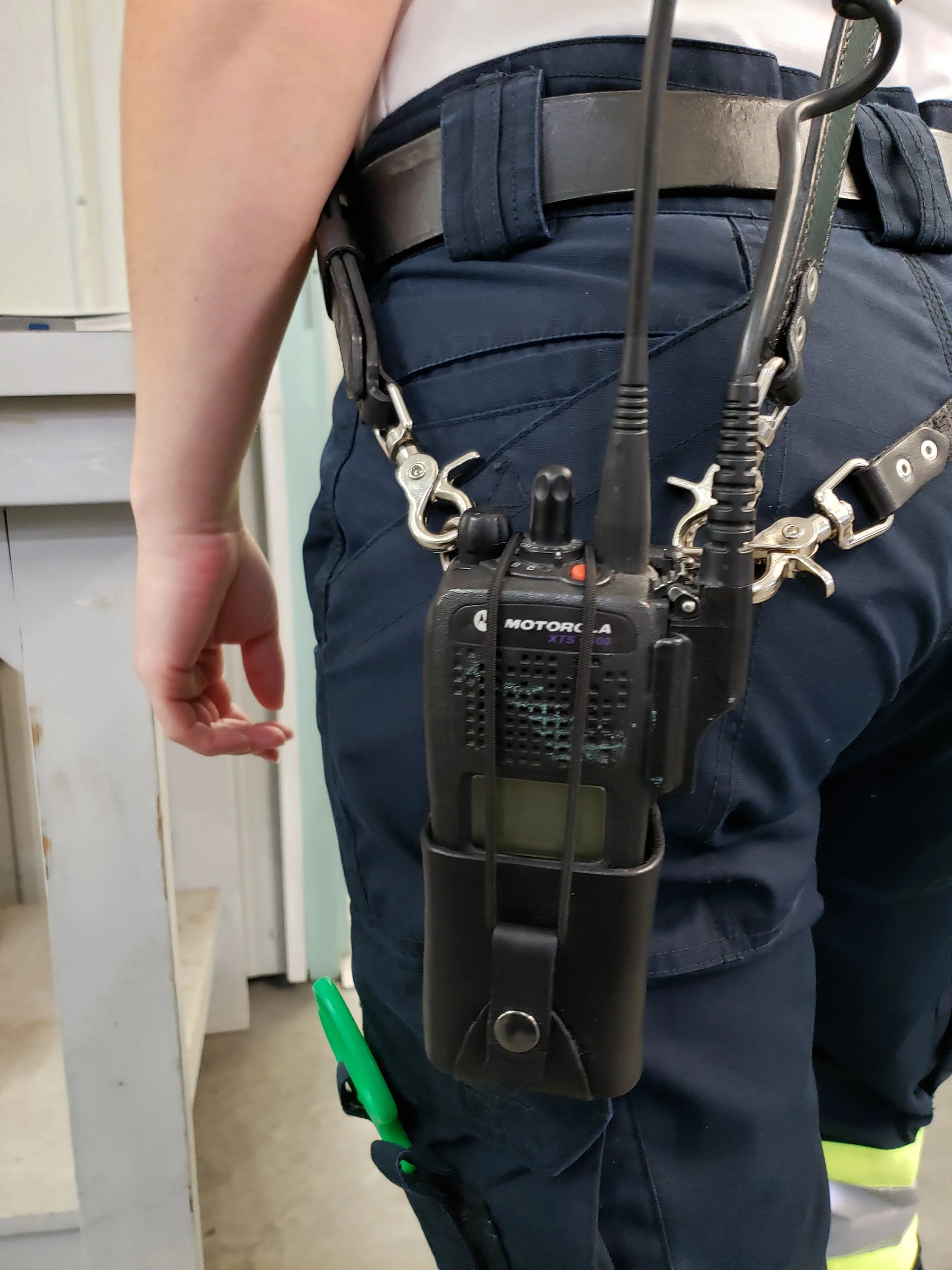 Awl Star Leather radio harness being worn with communications equipment secured at the side.