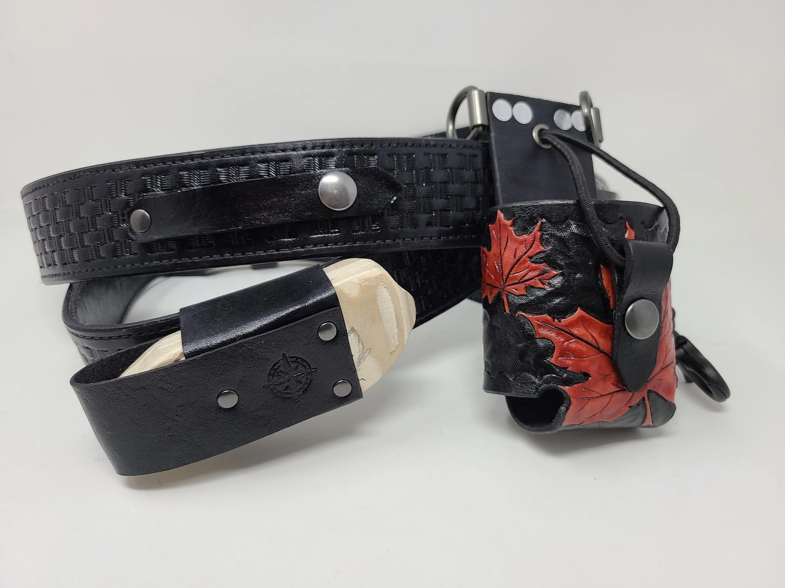 Collection of handcrafted Awl Star Leather radio harnesses showing custom engraving and different configurations.