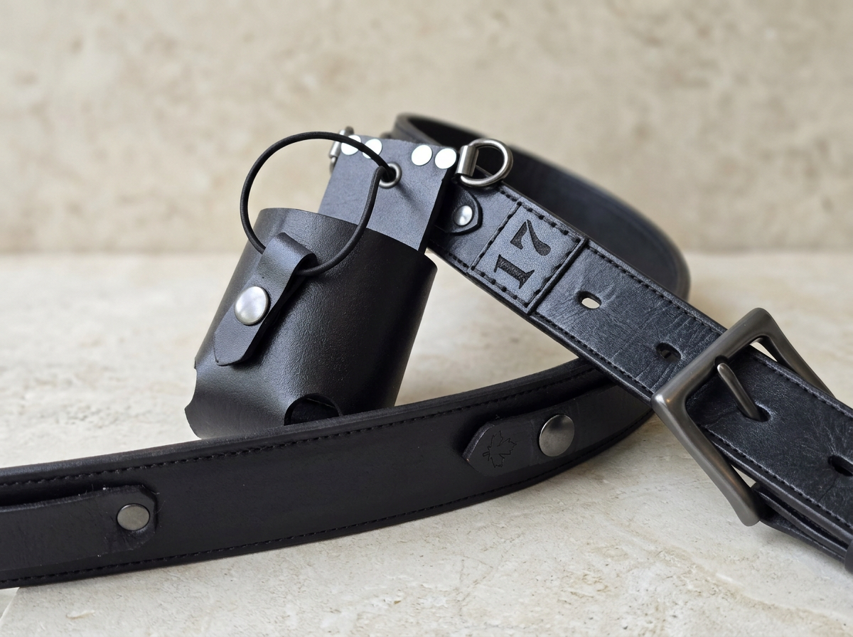 Handcrafted black leather Awl Star Leather radio harness with radio basket and gunmetal hardware.