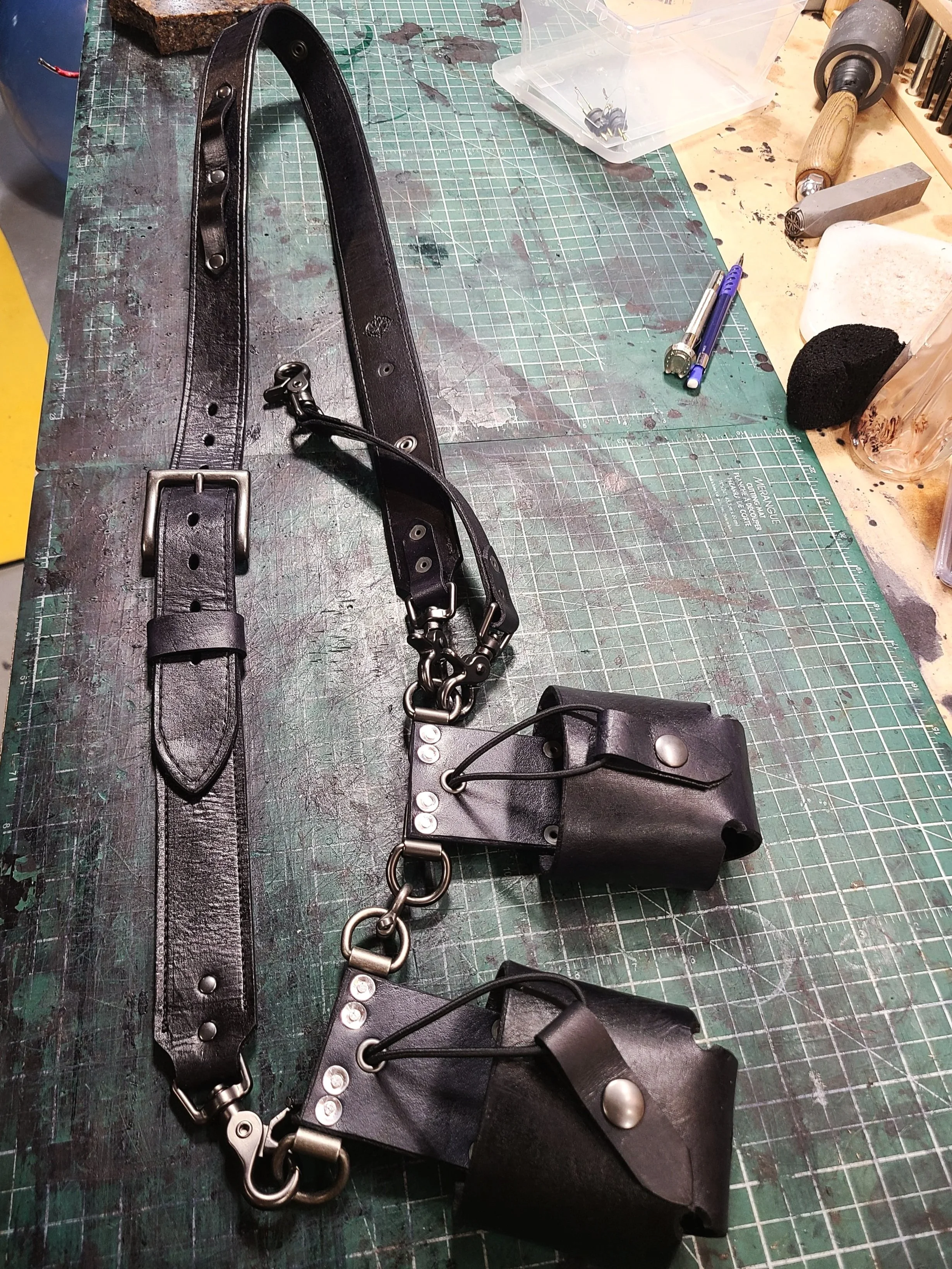 Awl Star Leather double-basket radio harness being handcrafted on the leather workbench.