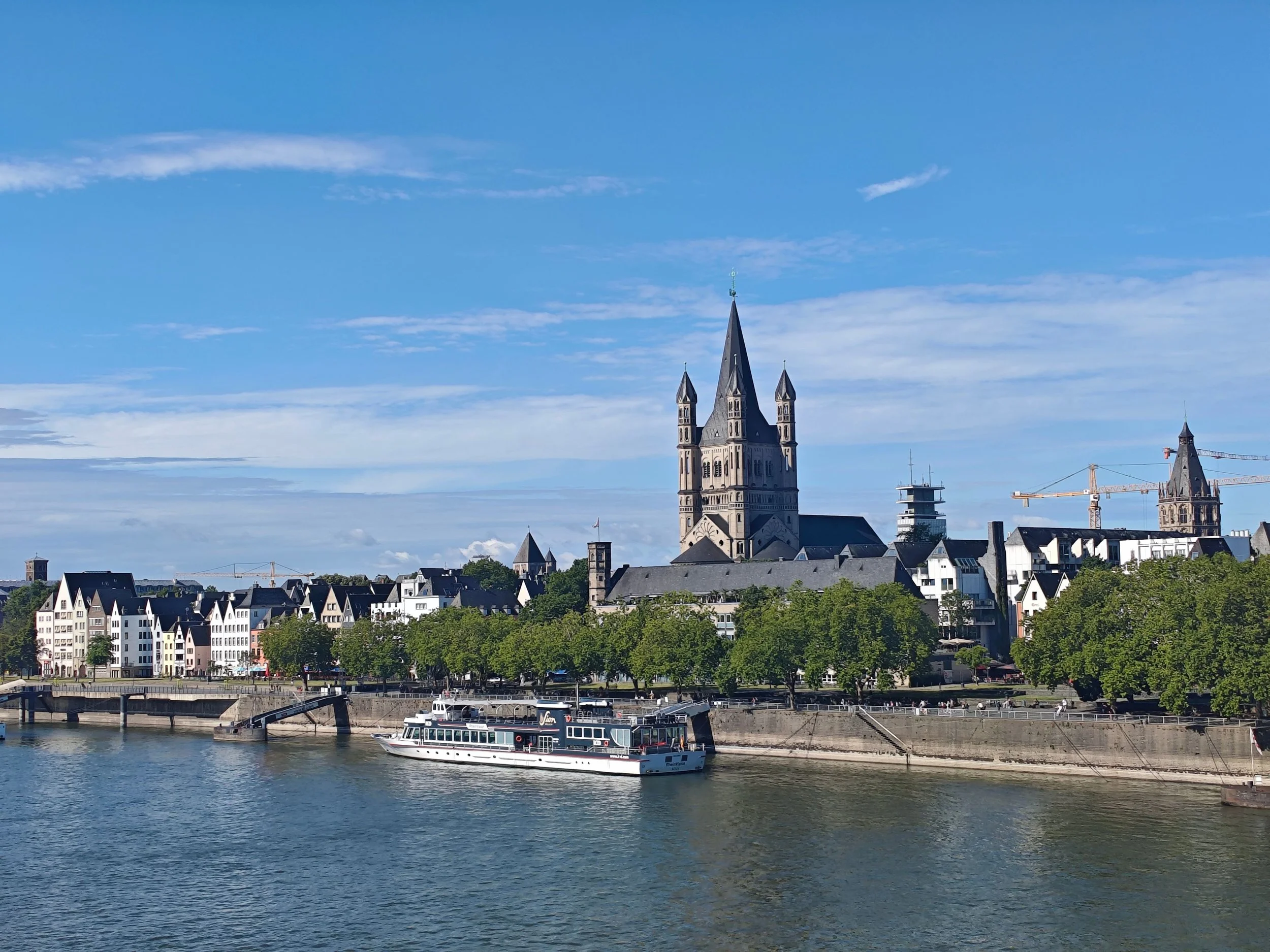 City/river image: European riverfront city viewed from the river during a river cruise.