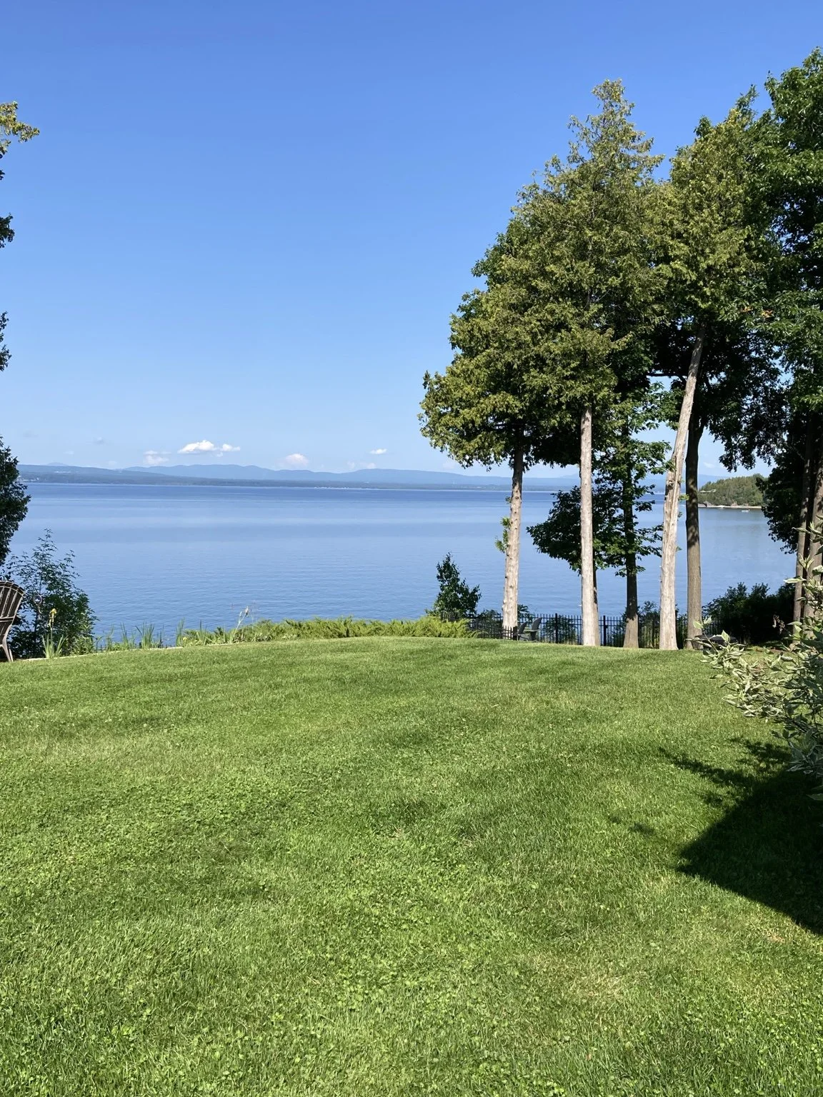 Lakefront lawn maintained by Catamount Mowing