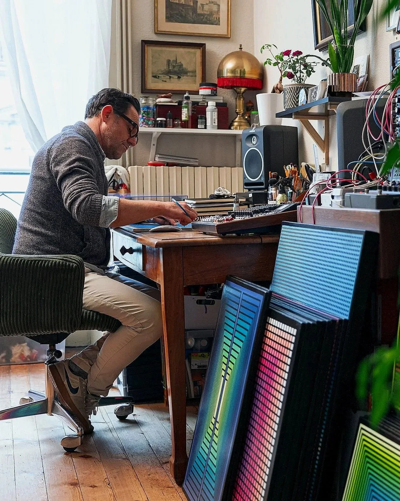 French artist David GAREL creating a geometric kinetic painting in his art studio.