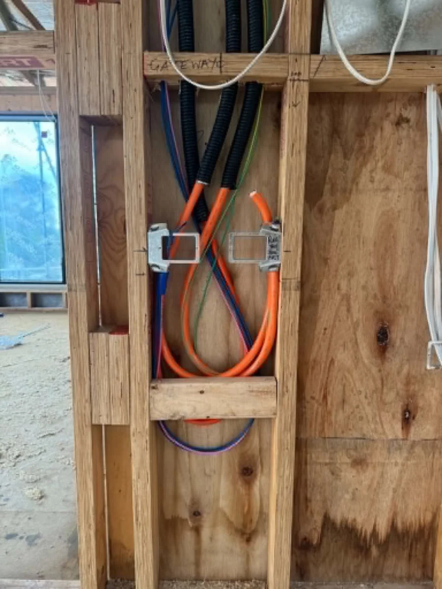Conduit and cabling run through a timber frame