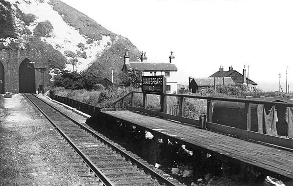 Shakespeare Halt in 1958 with railway cottages in the background. The only access to the cottages was by rail or climbing the 333 steps up the cliff seen next to the tunnel entrance. (Photo by HC Casserley)