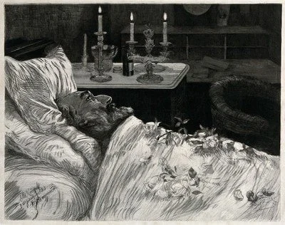 A man lying in a bed propped up be pillows with flowers laid on top of him representing a man on his deathbed.
