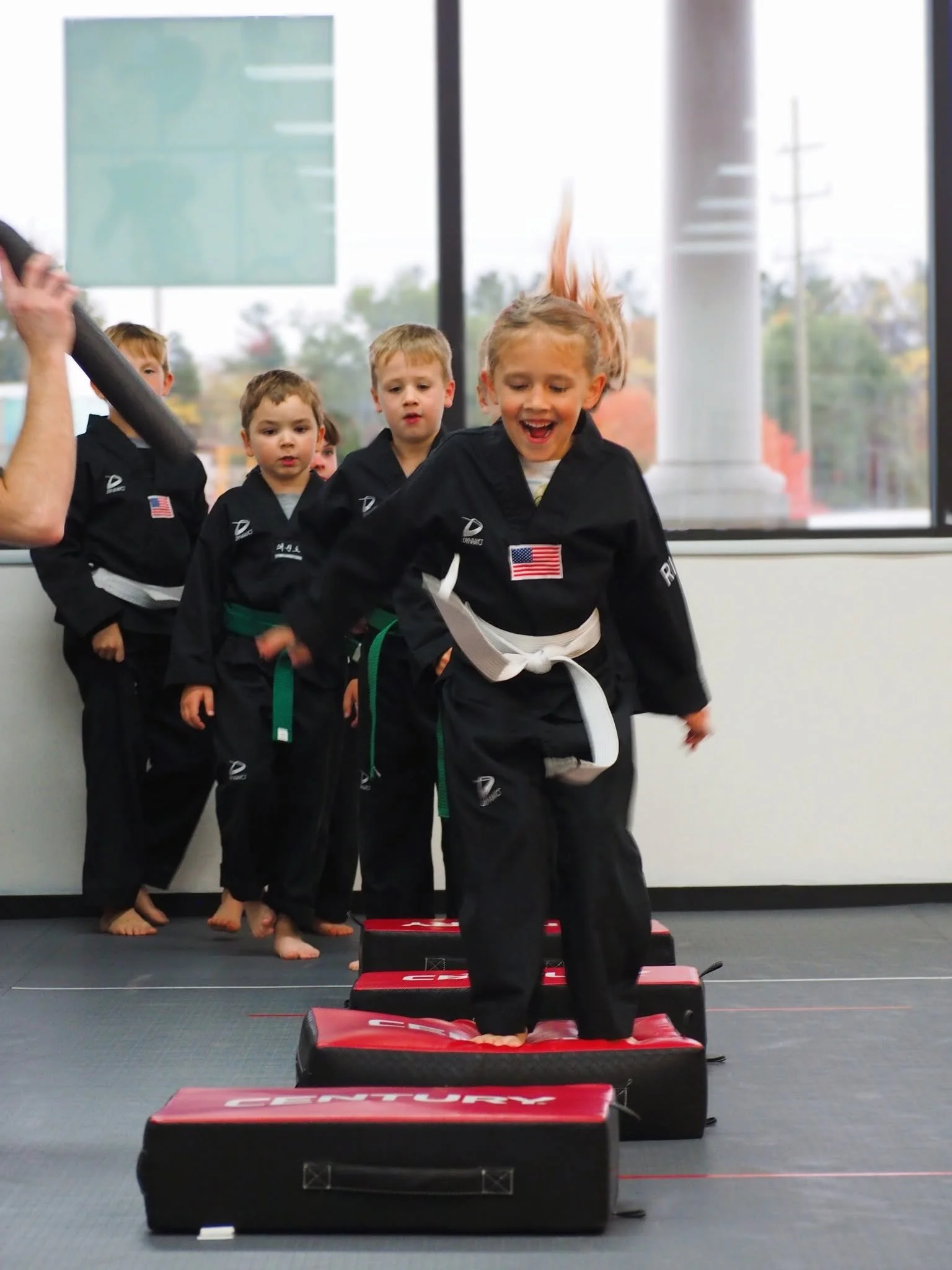 Girl playing a martial arts game laughing.jpg