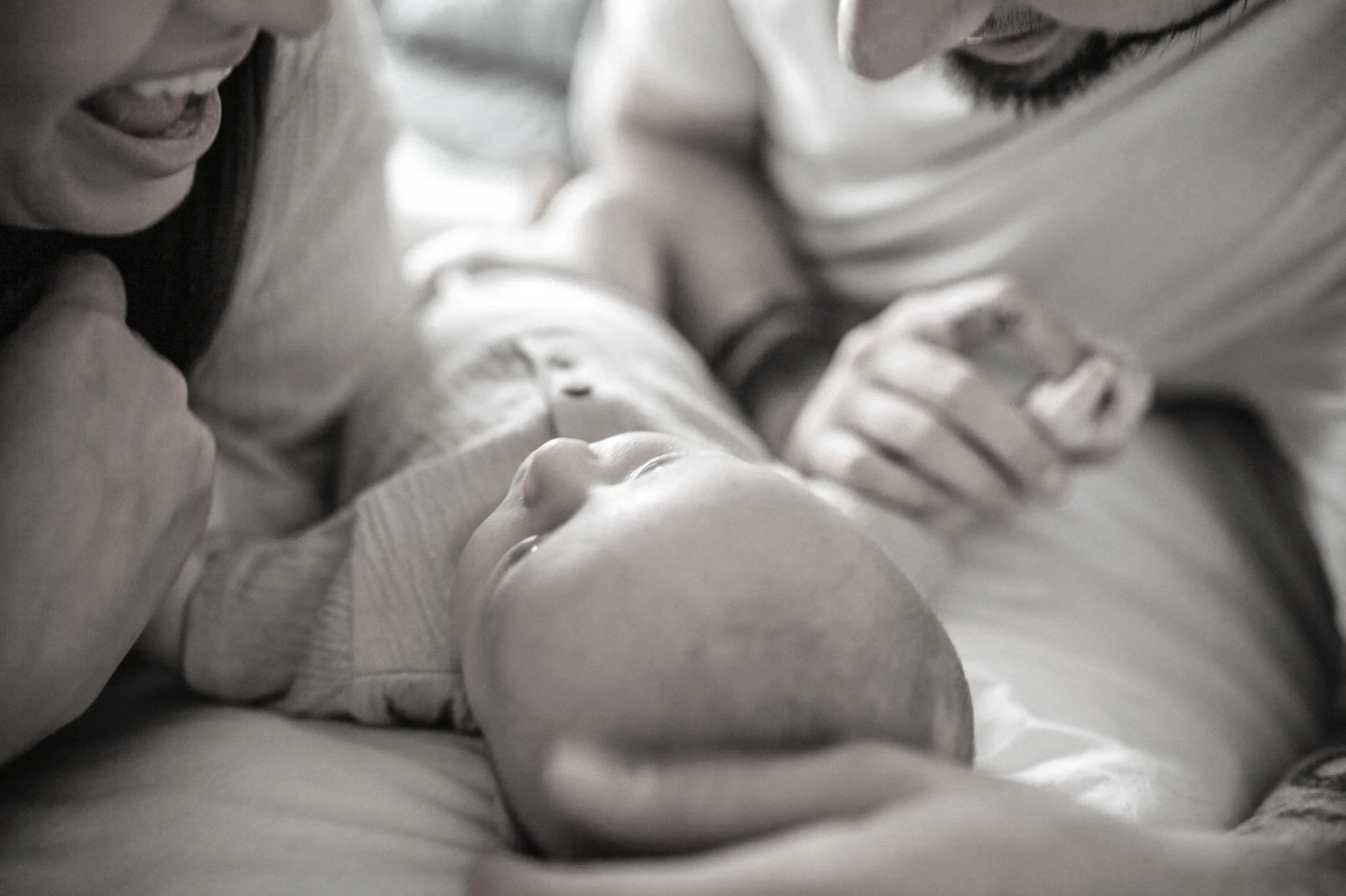 Close-up of two people kissing, with focus on their faces and closed eyes.