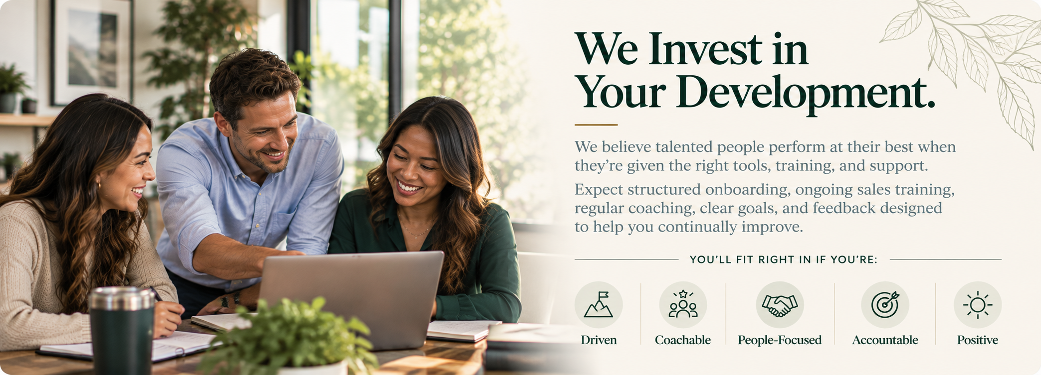 Three people, two women and one man, sitting at a table in a bright, modern office, smiling and looking at a laptop, with text about investment and development on the right side of the image.