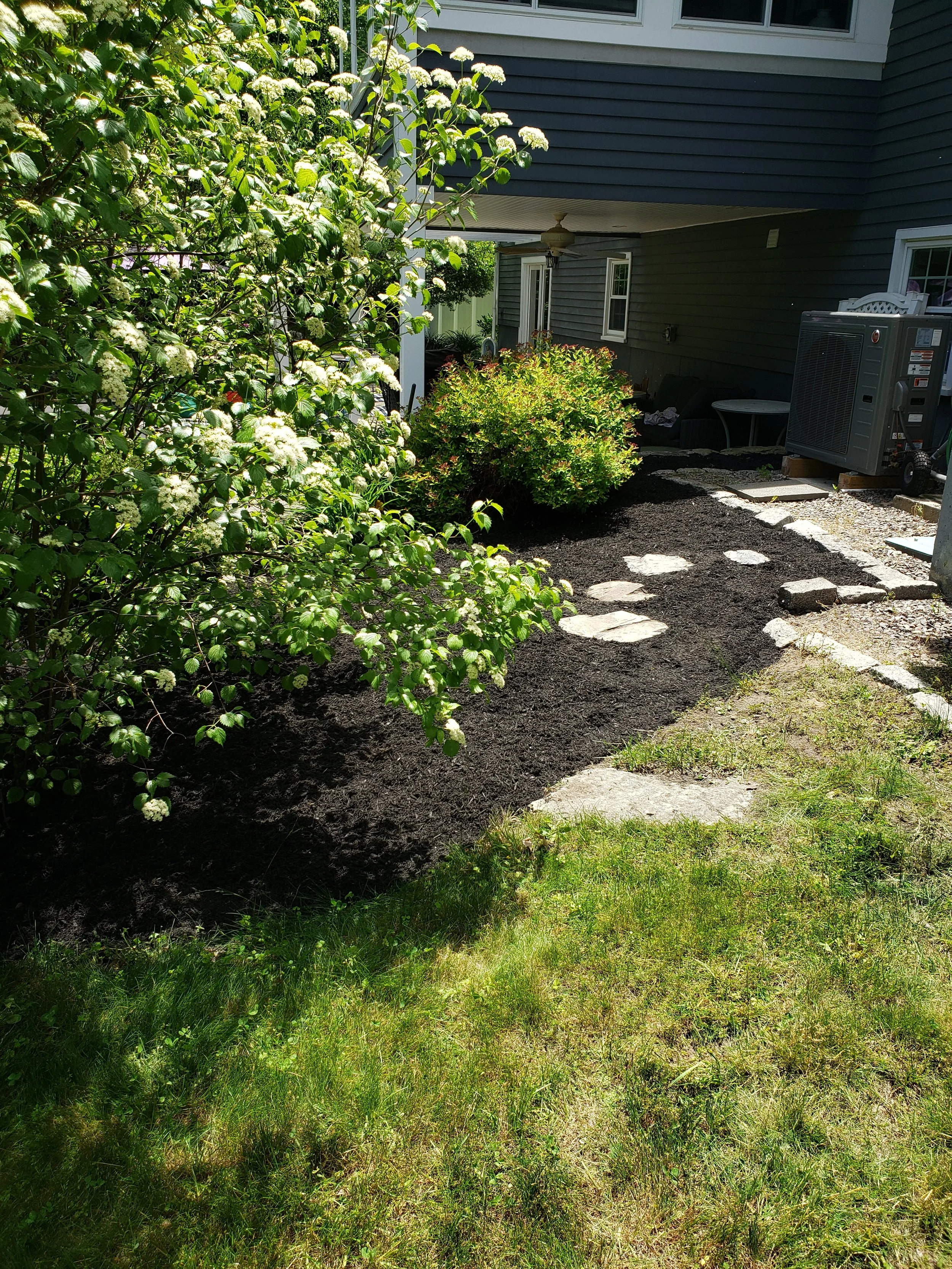 A backyard mulched stepping stone area I gave a referesh.