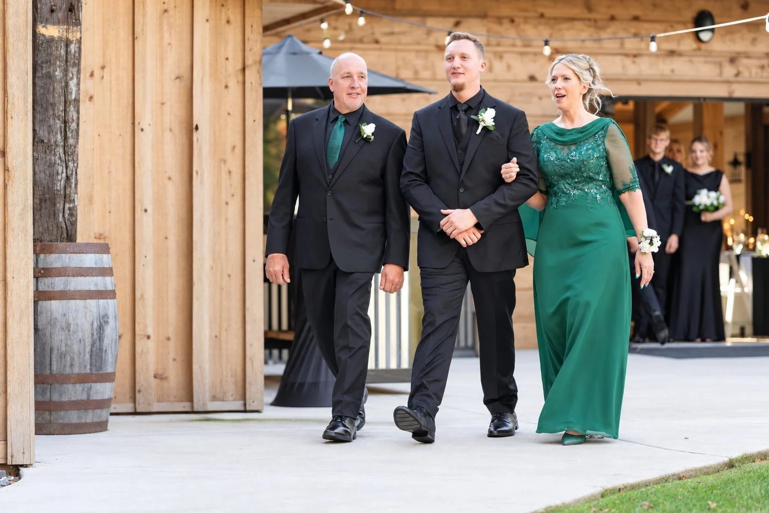Josh & Parents walking down the isle.jpg