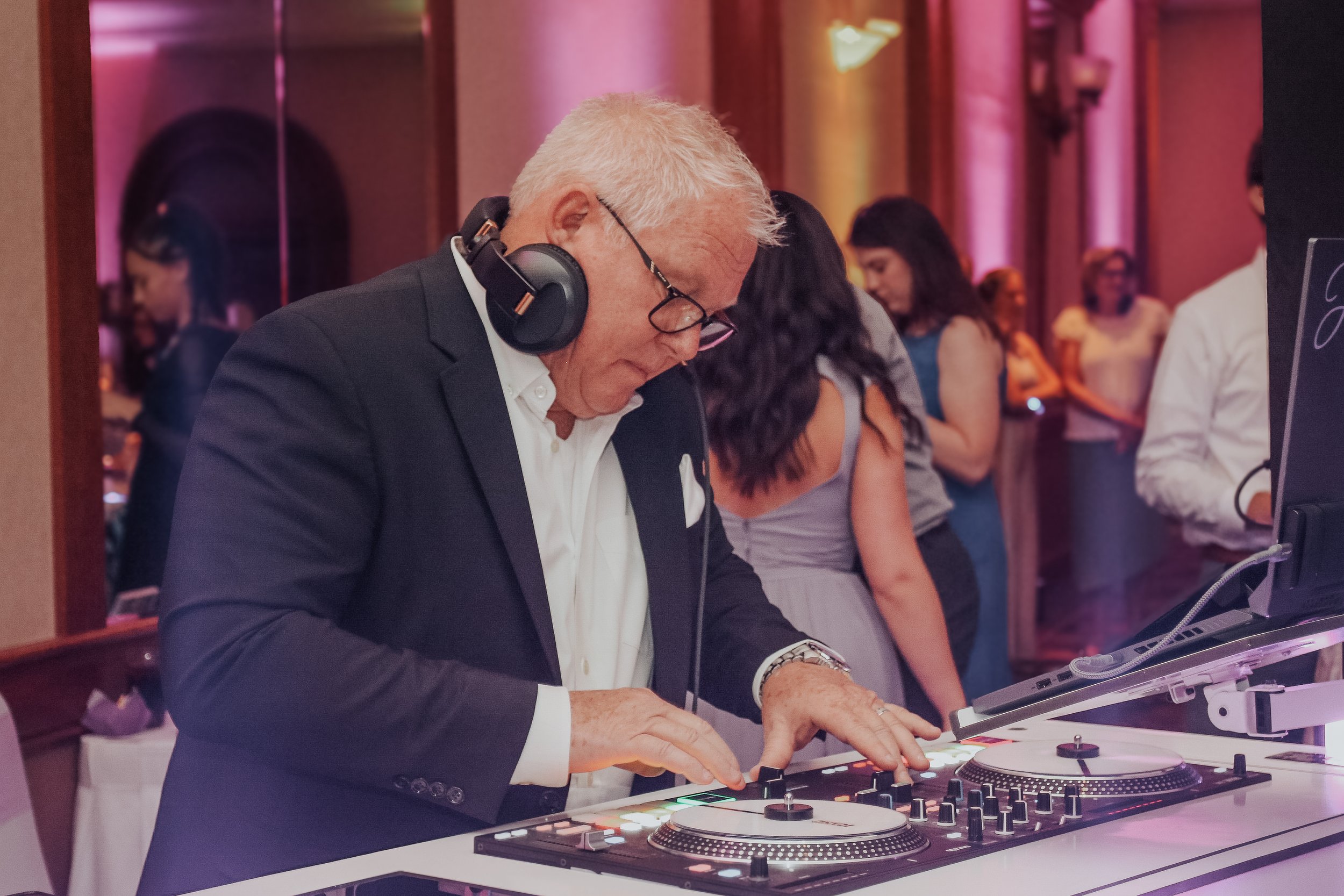 Johnny Dutcher, NightBeat Entertainment DJ, live-mixing at a wedding reception