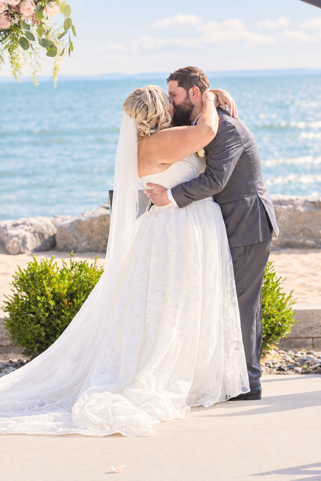 Sunlit Waterfront Wedding Kiss.png