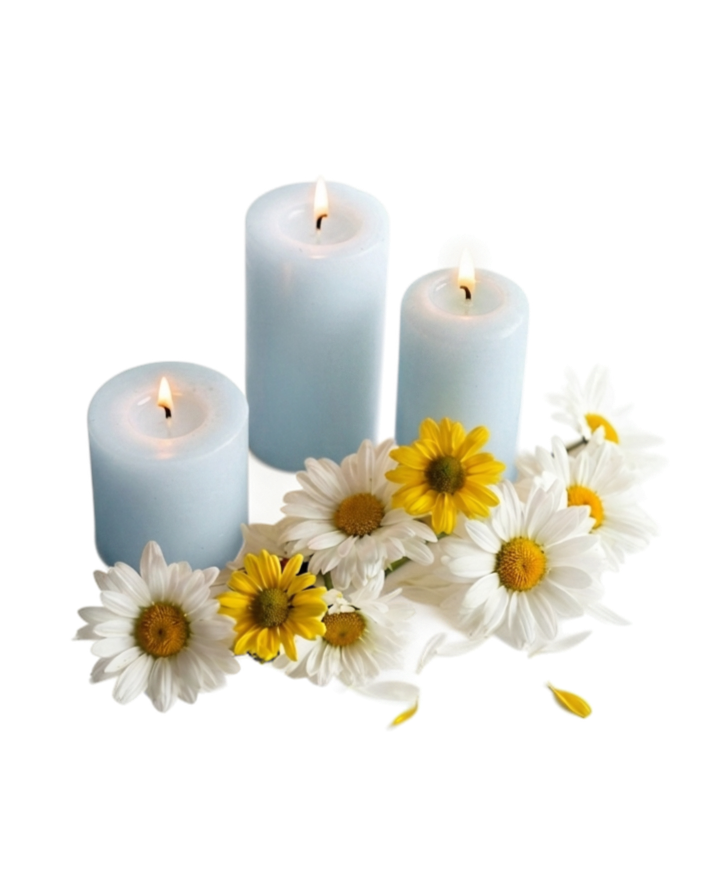 Three blue candles lit and surrounded by white and yellow daisies, Imbued Events celebration of life planning in Austin, TX