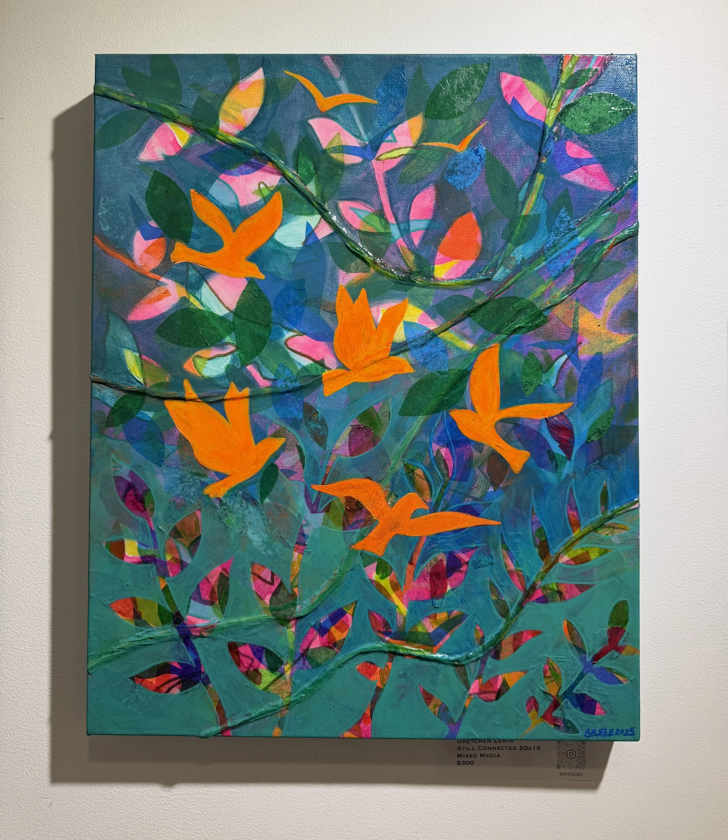 Mixed media art piece featuring colorful abstract shapes and foliage, with orange bird silhouettes, on a blue-green background.