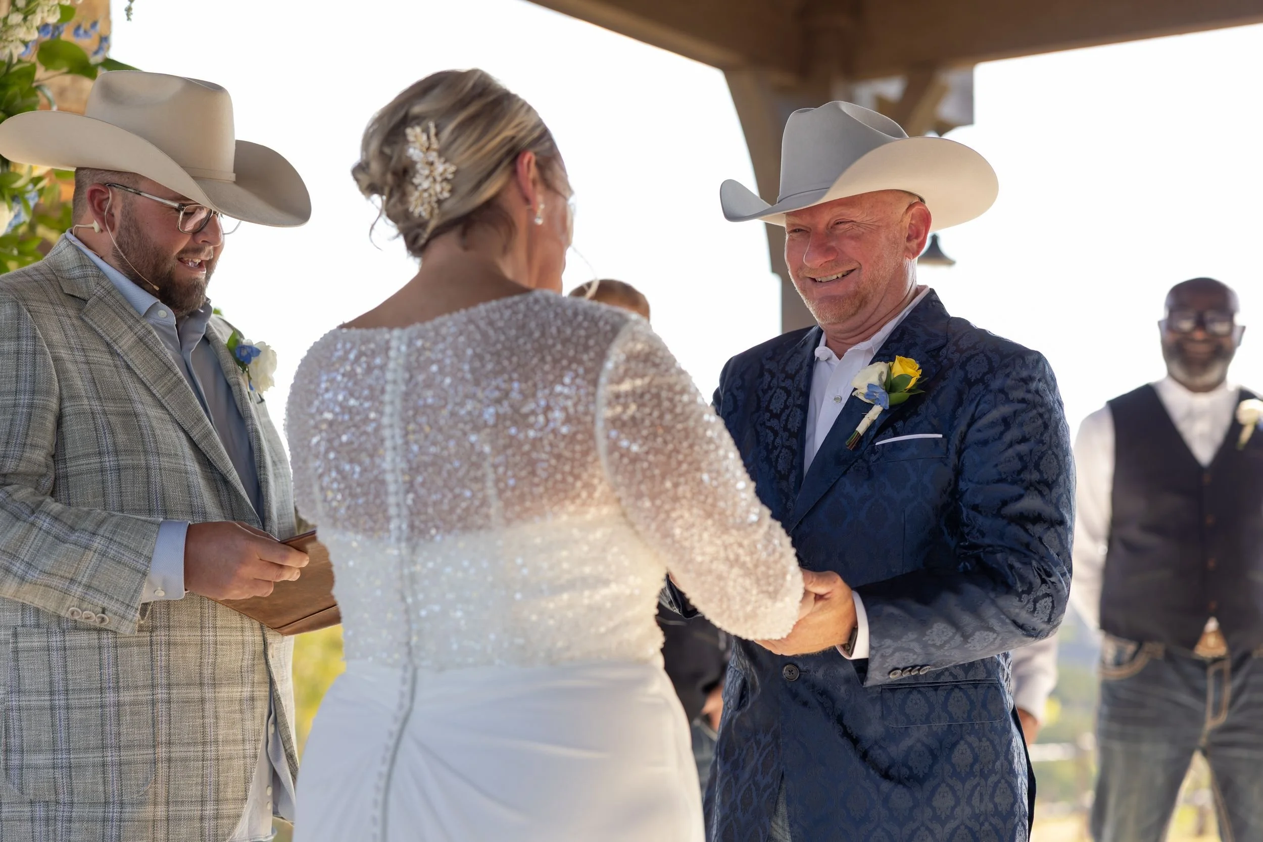 Jason and Lacey laughing at the altar during their Weatherford wedding ceremony