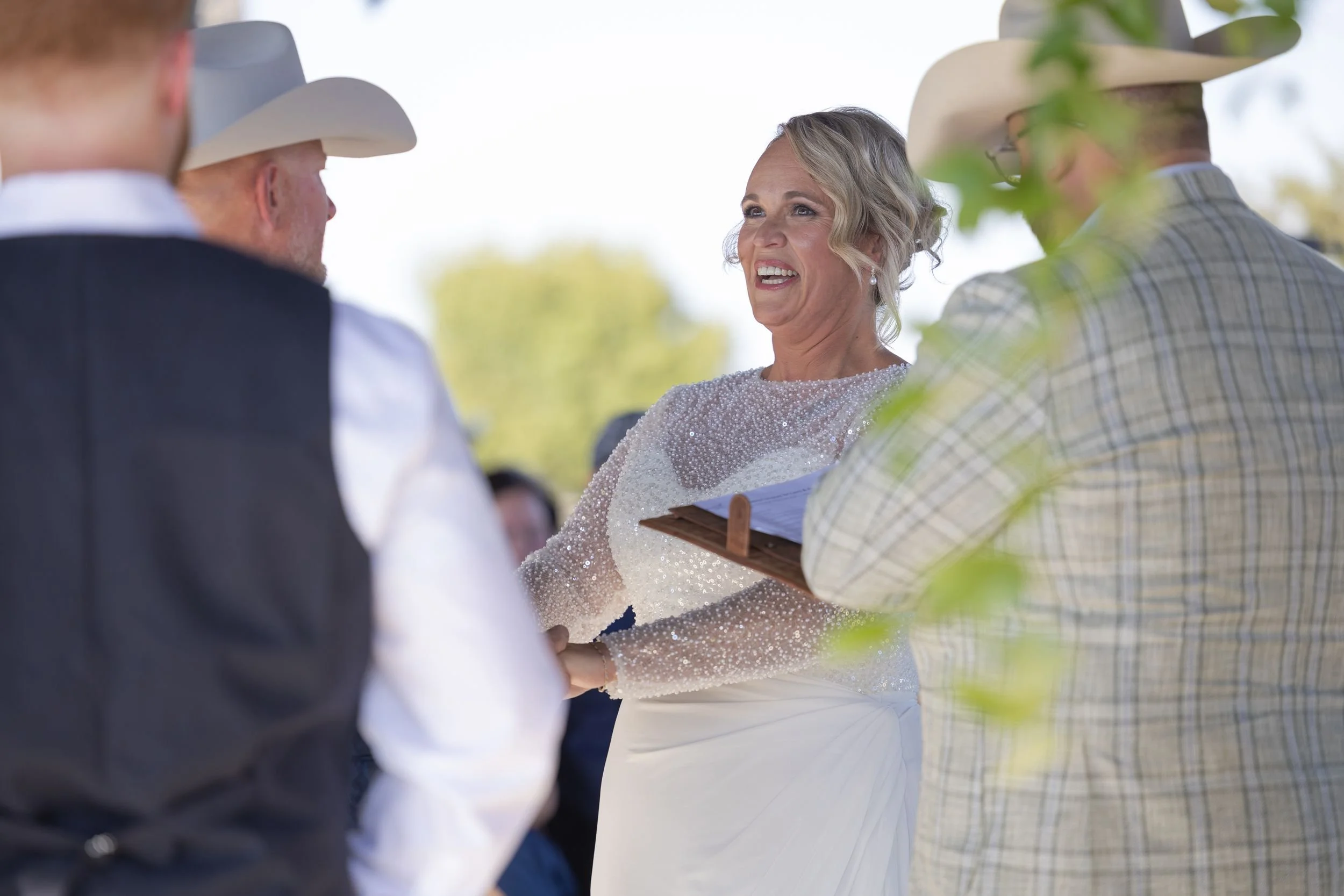 Bride and groom exchanging vows during their Dove Ridge Vineyard ceremony