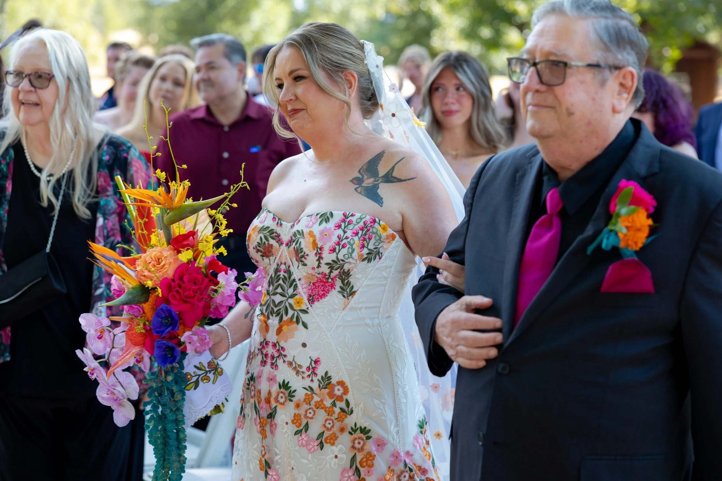 Bride laughing with guests during the ceremony at The Orchard in Azle, Texas