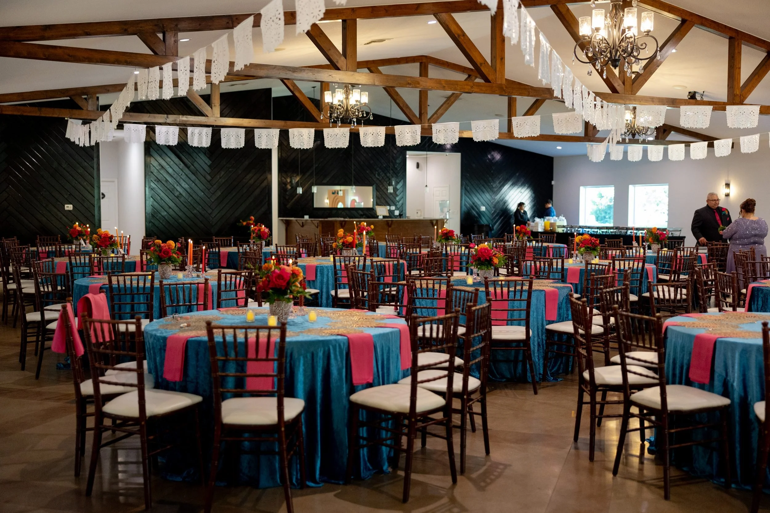 Reception pavilion with colorful table linens at The Orchard wedding venue in Azle
