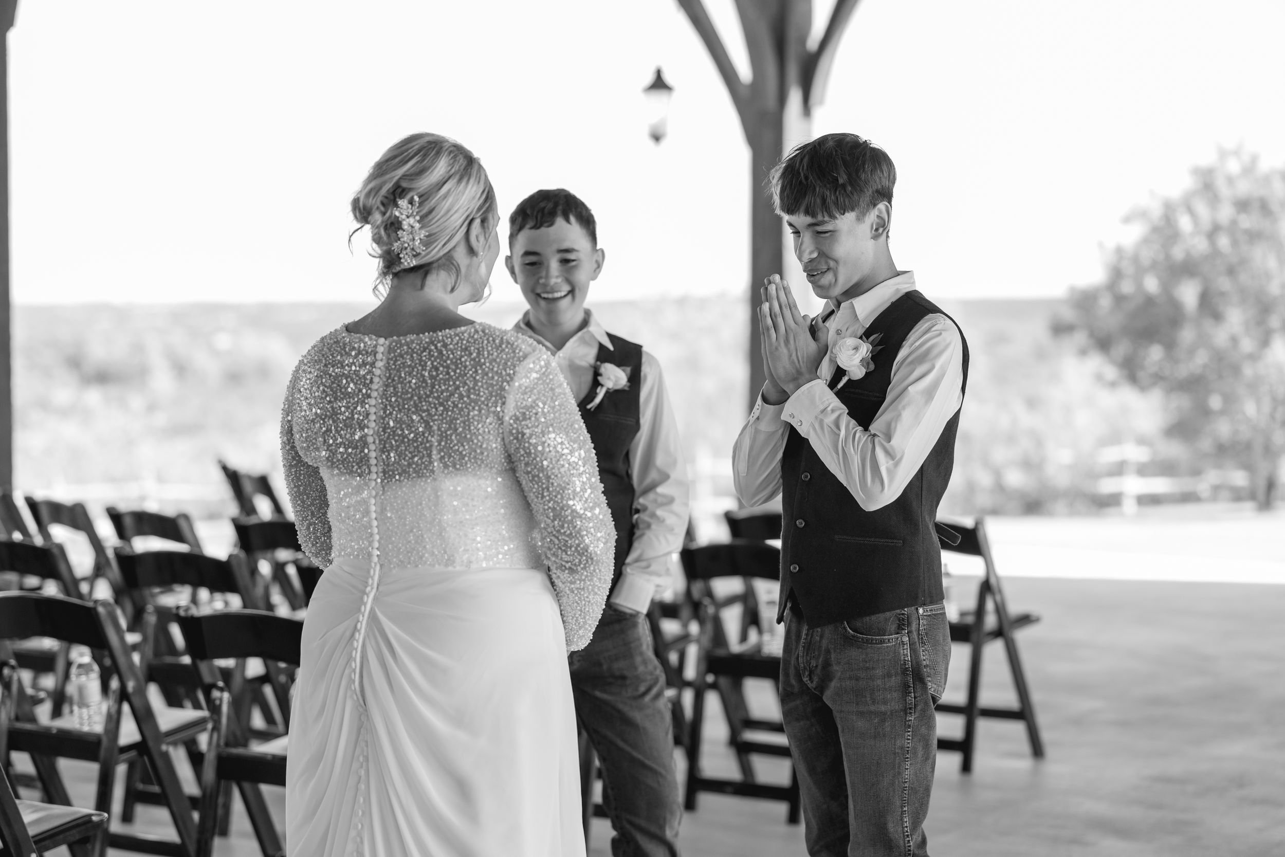 Black-and-white photo of the bride with two young groomsmen before the ceremony at Dove Ridge Vineyard