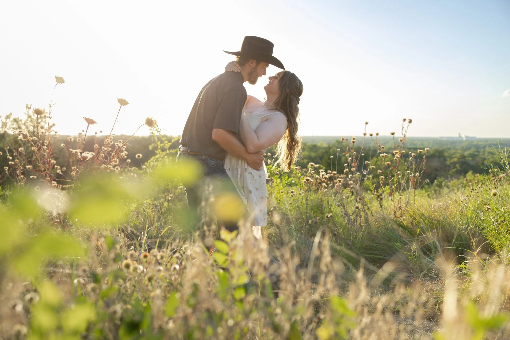 golden-hour-cowboy-engagement-photos-wildflowers.jpg