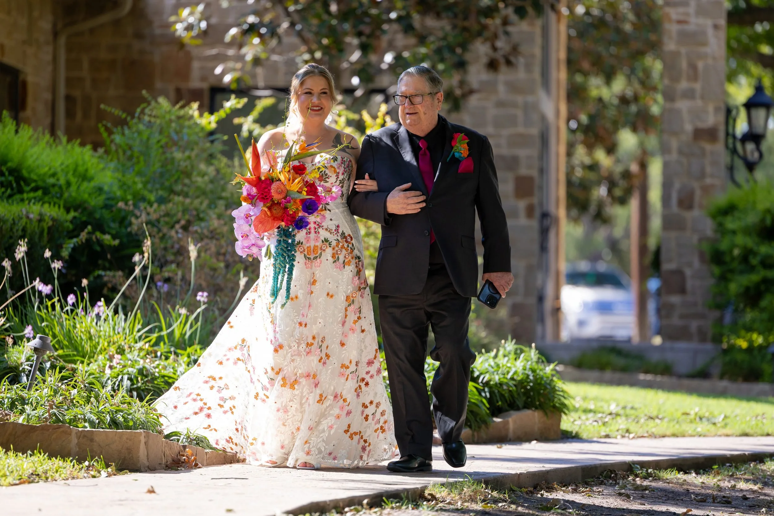 Carita walking down the aisle with her father at The Orchard in Azle, Texas