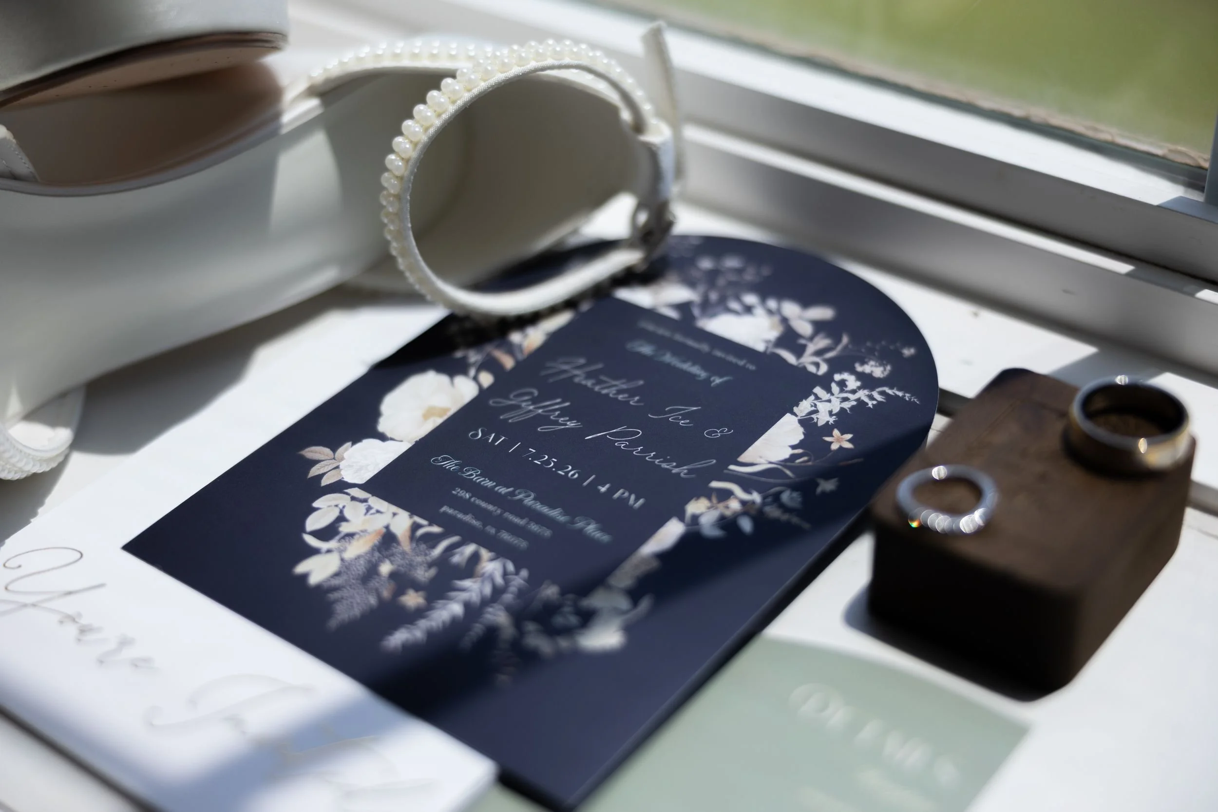 Navy wedding invitation and ring details for Heather and Geffrey's Weatherford wedding