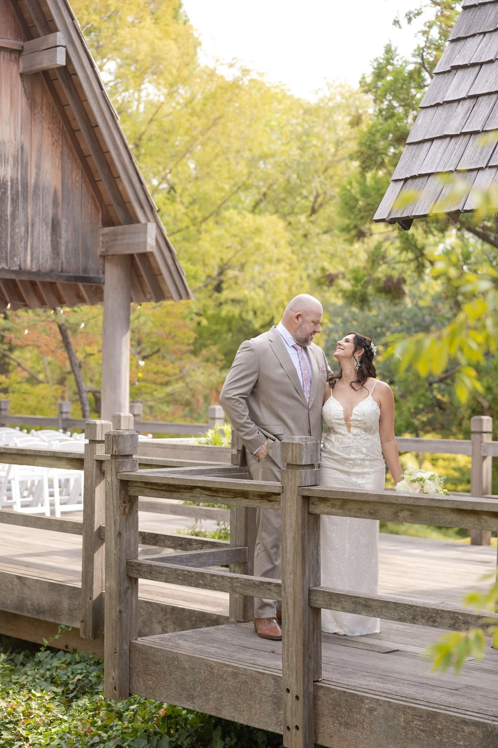 Lydia and Ryan walking across a wooden bridge at the Fort Worth Japanese Garden