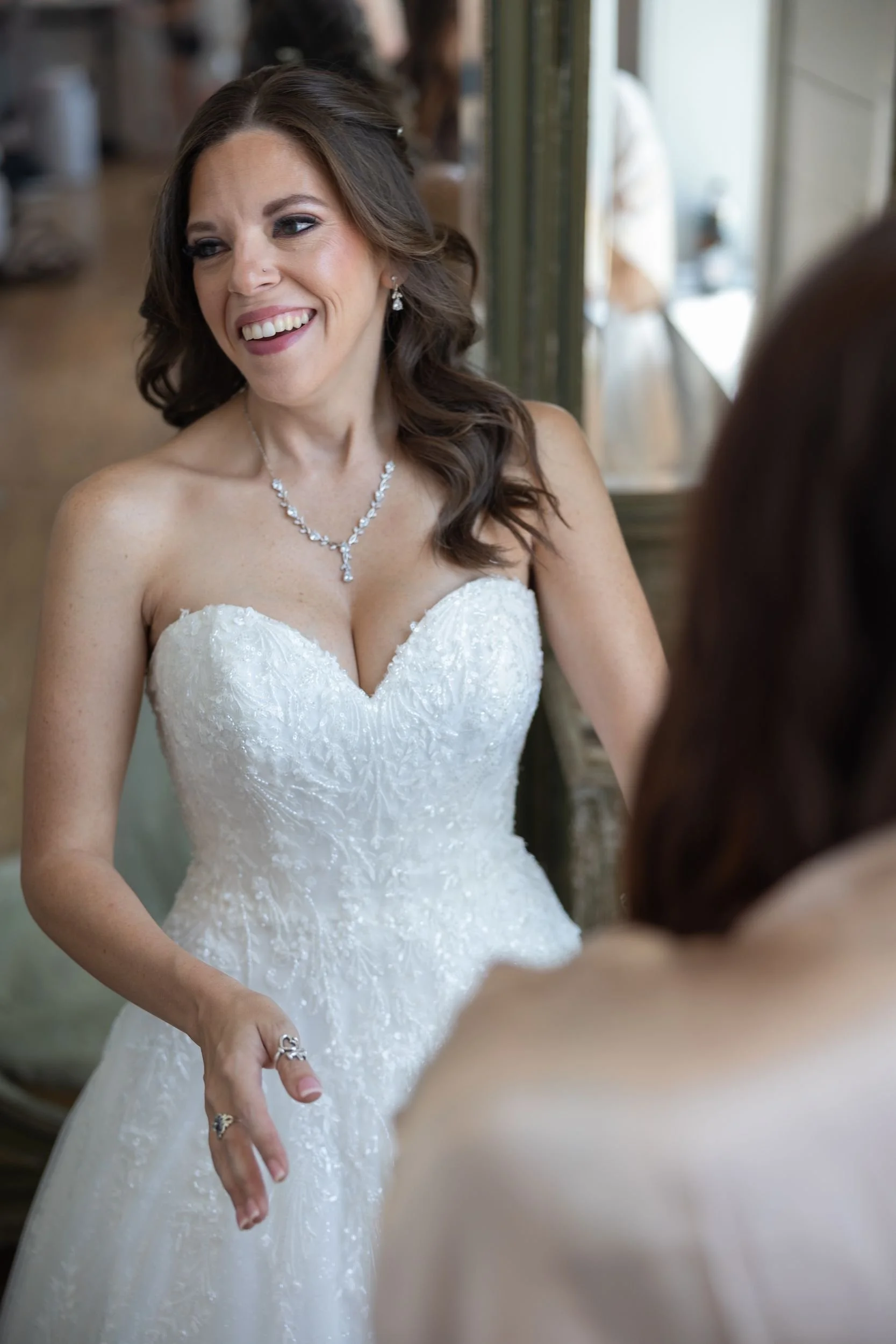 Bridal portrait of Heather in her strapless gown and veil in the bridal suite