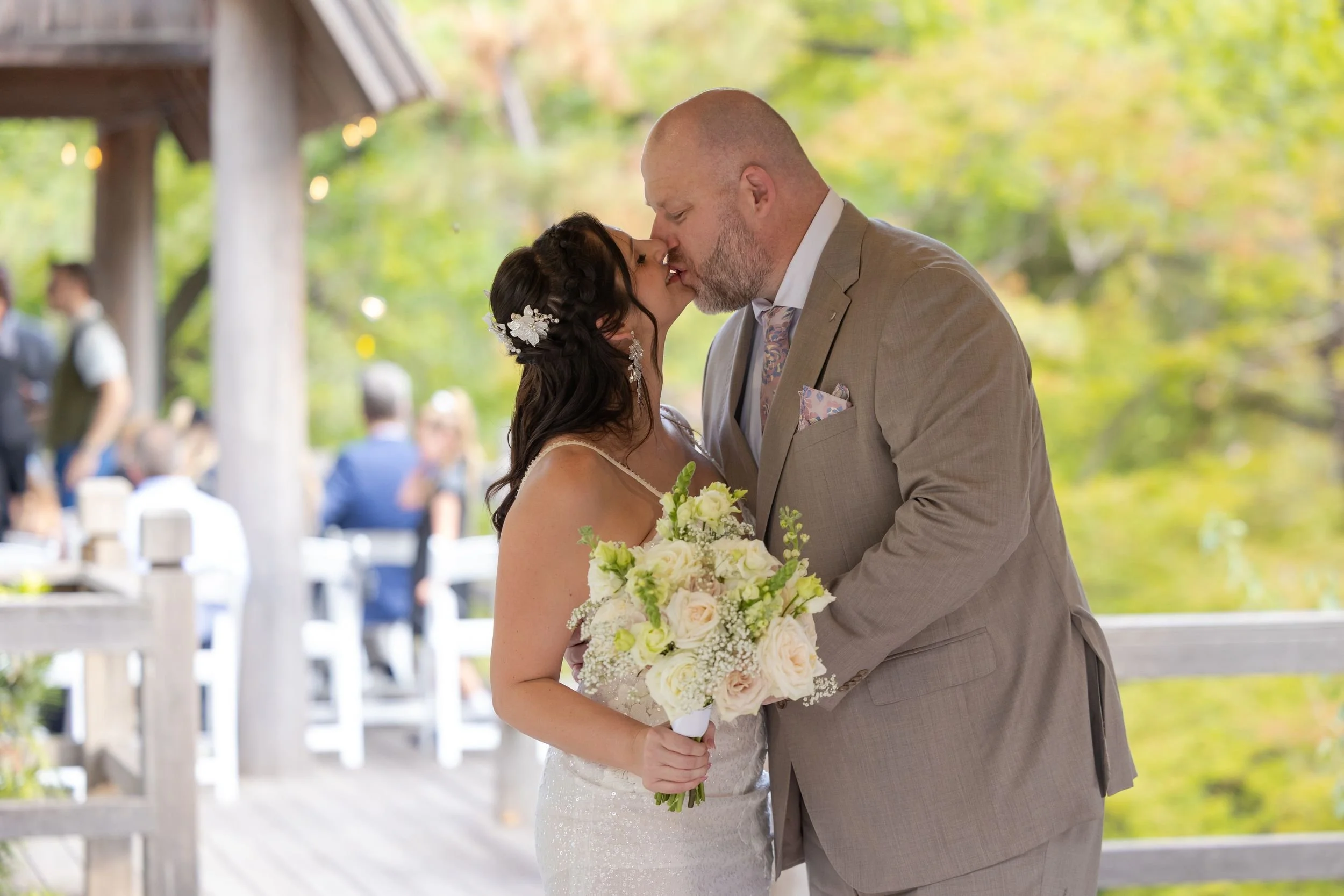Lydia and Ryan share their first kiss at their Fort Worth Japanese Garden ceremony