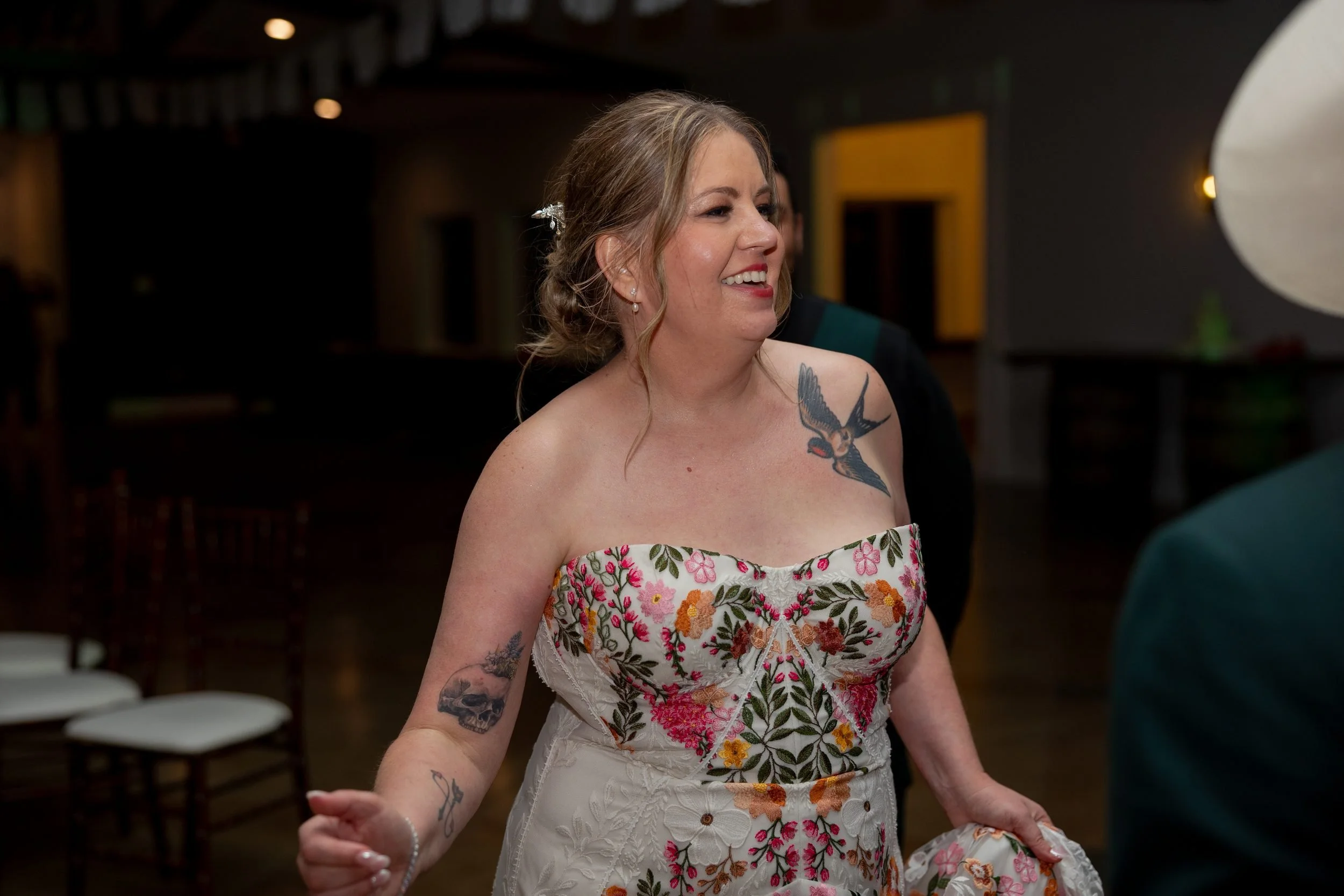 Carita dancing in her floral wedding dress at The Orchard reception