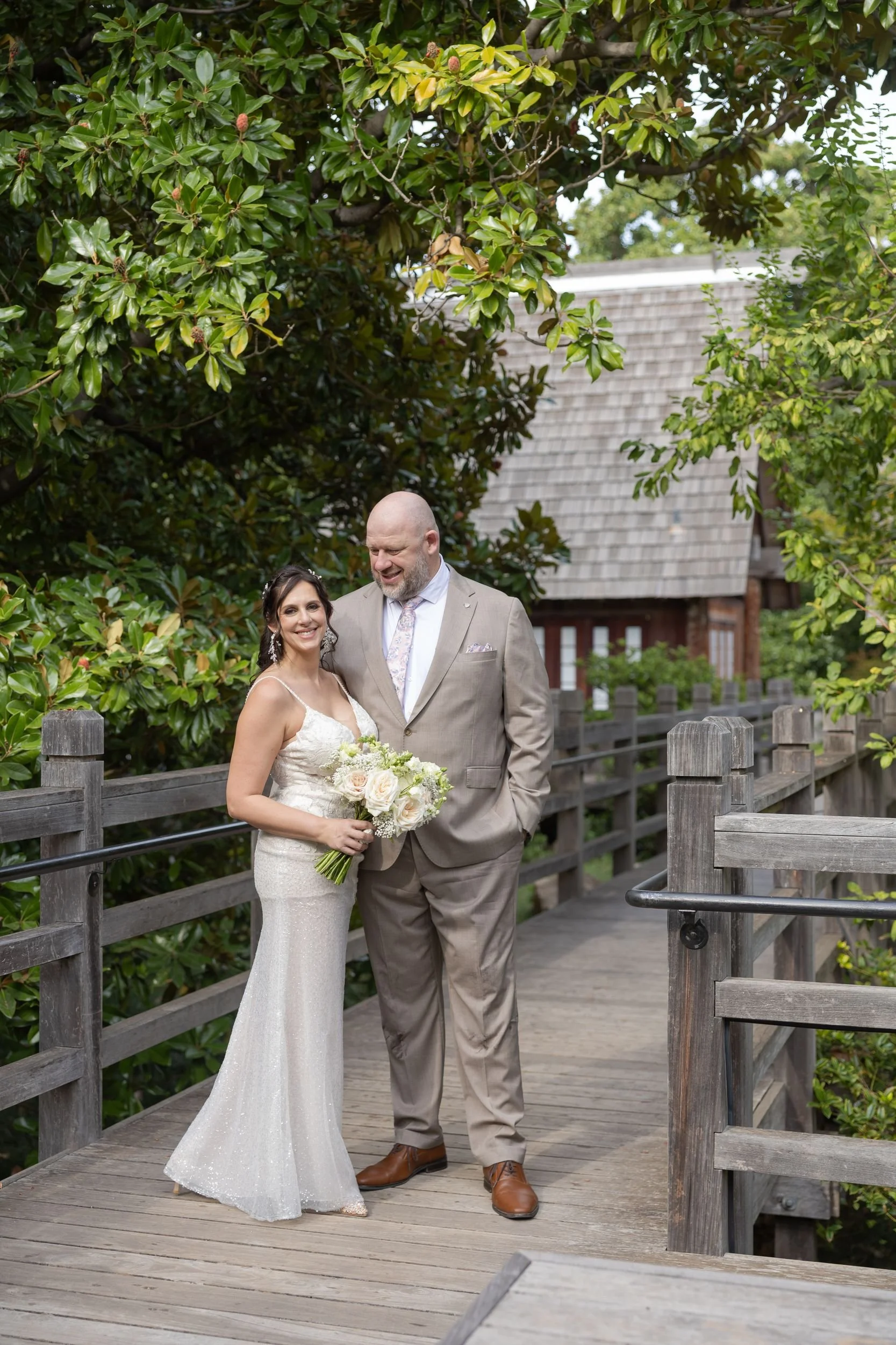Bride and groom on a wooden walkway at the Fort Worth Japanese Garden