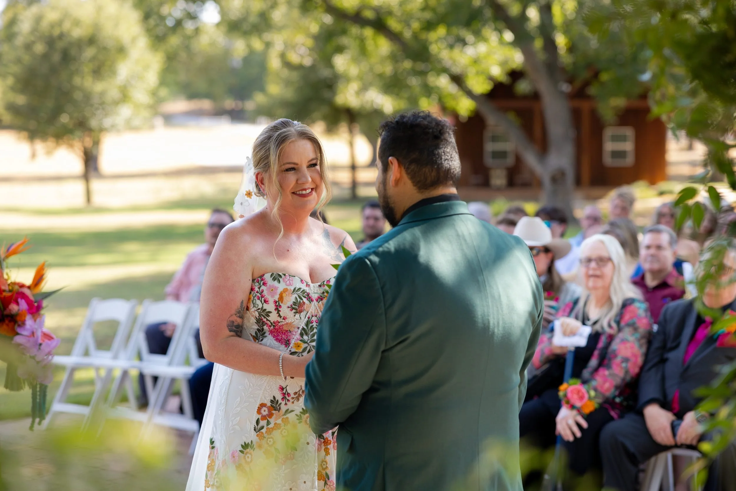 Bride and groom sharing a moment with guests after the ceremony at The Orchard