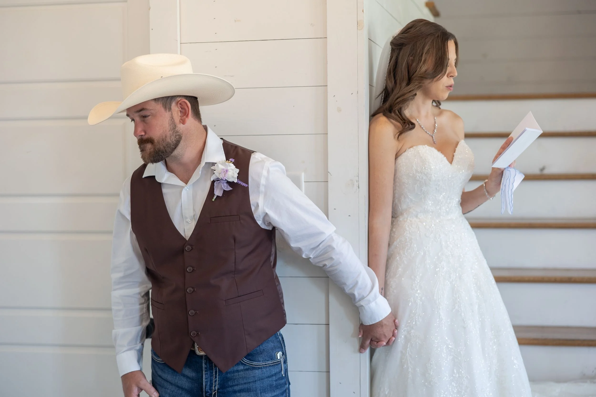 Bride and groom on either side of a wall for a no-peek moment before the ceremony
